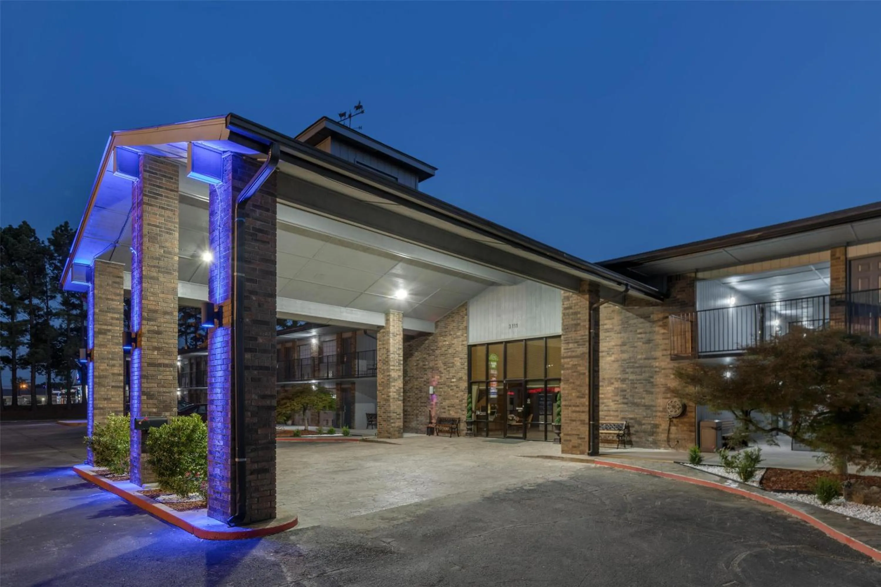Property building in SureStay Plus Hotel by Best Western Poteau