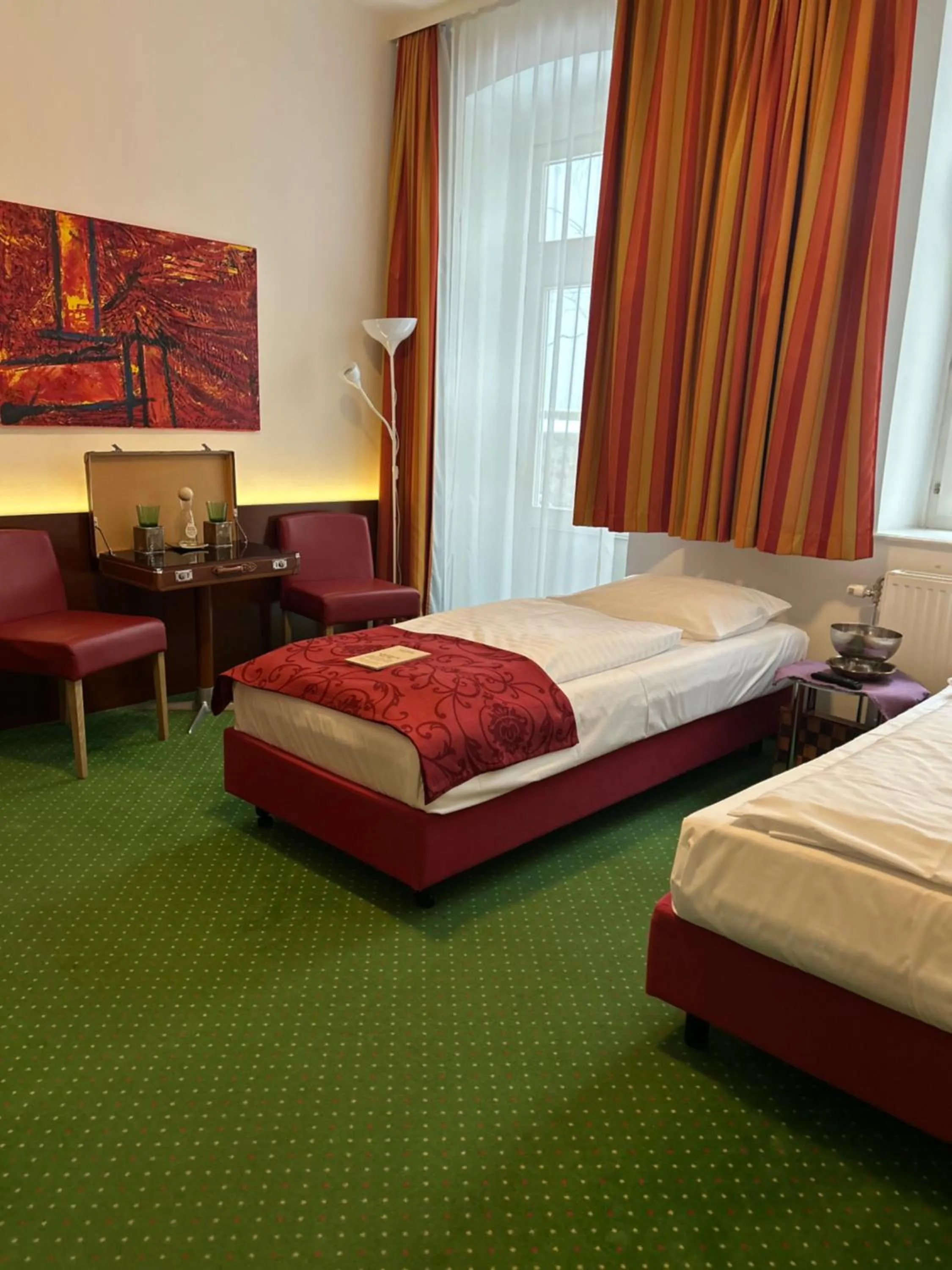 Photo of the whole room, Bed in Pension Stadthalle