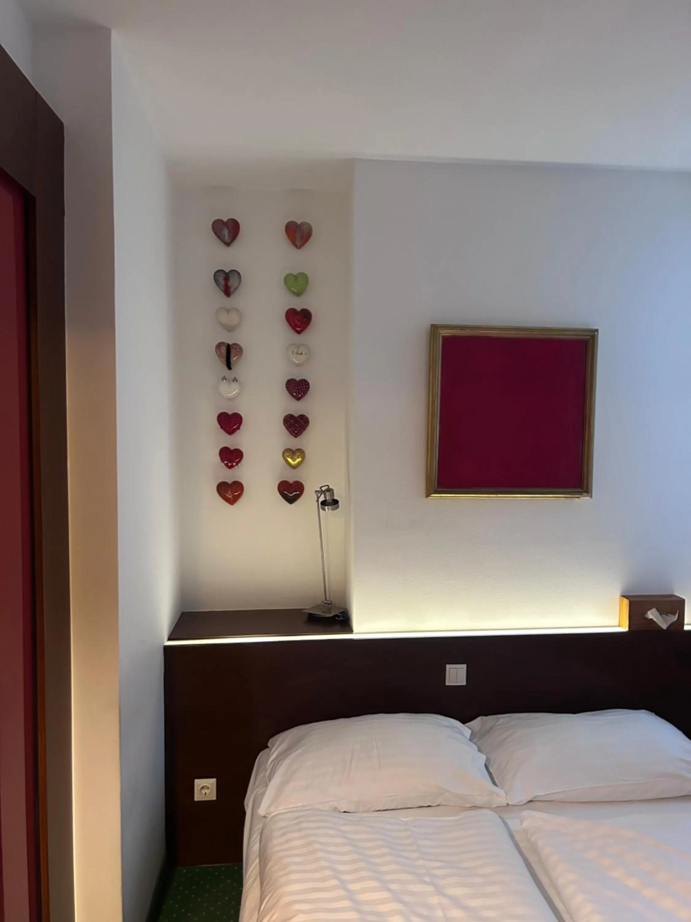 Photo of the whole room, Bed in Pension Stadthalle