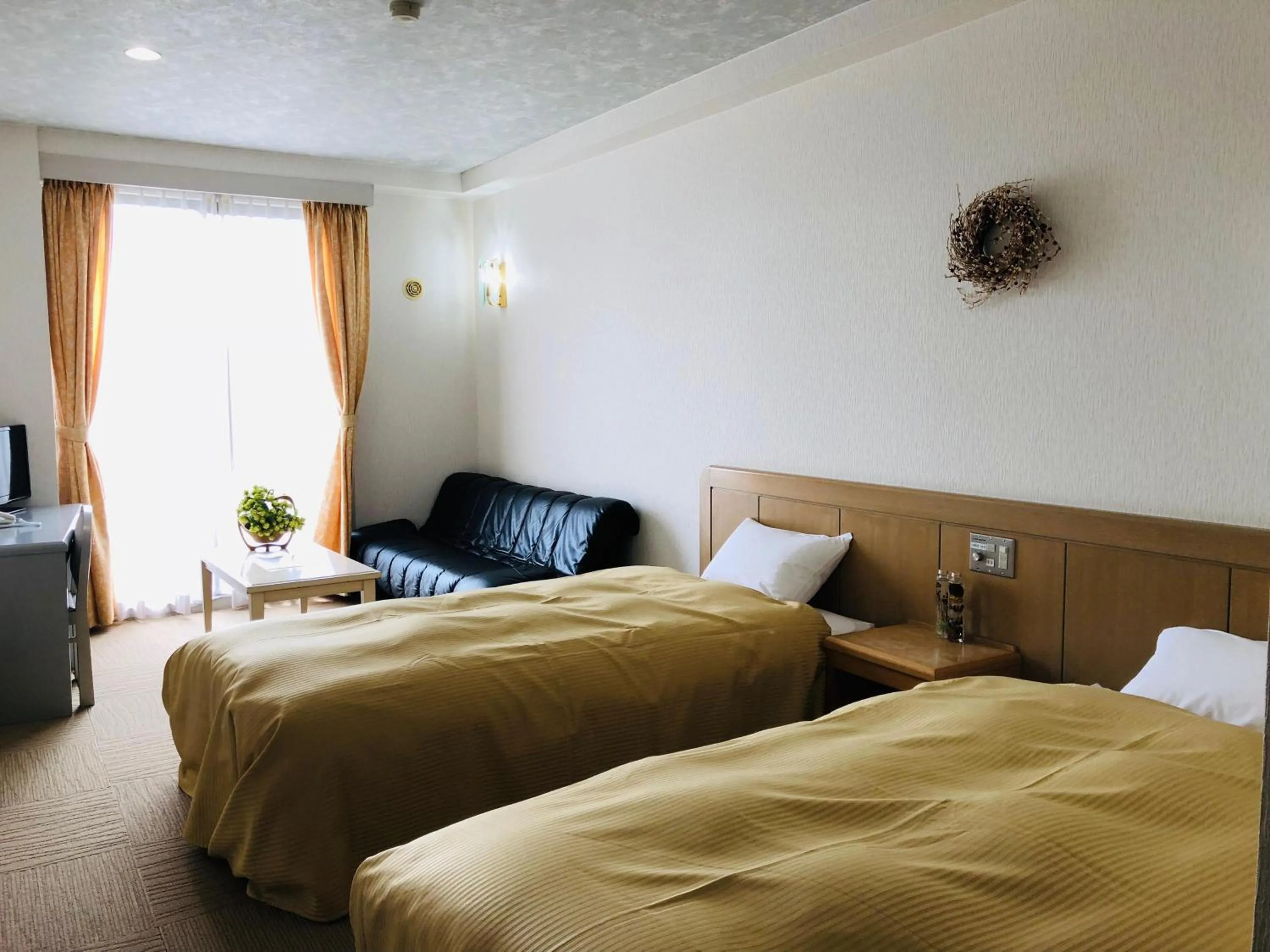 Photo of the whole room, Bed in Hotel Belle-Cour Inomata