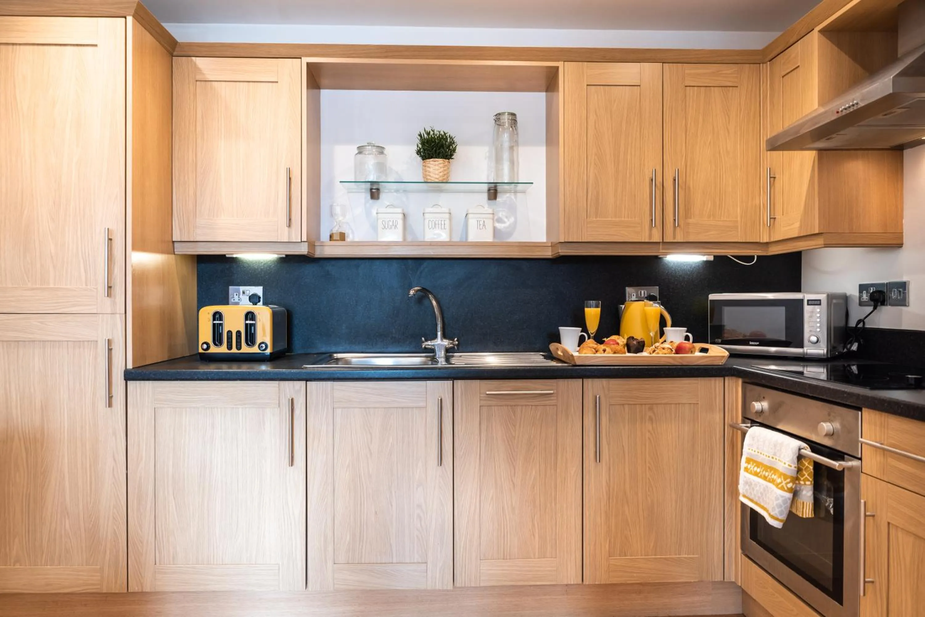 Kitchen or kitchenette in The Old Library - Modern Apartment near the Train Station and Racecourse
