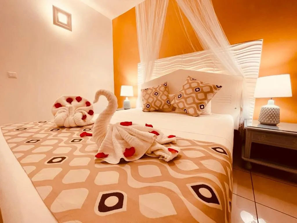 Bed in Tropicana Suites