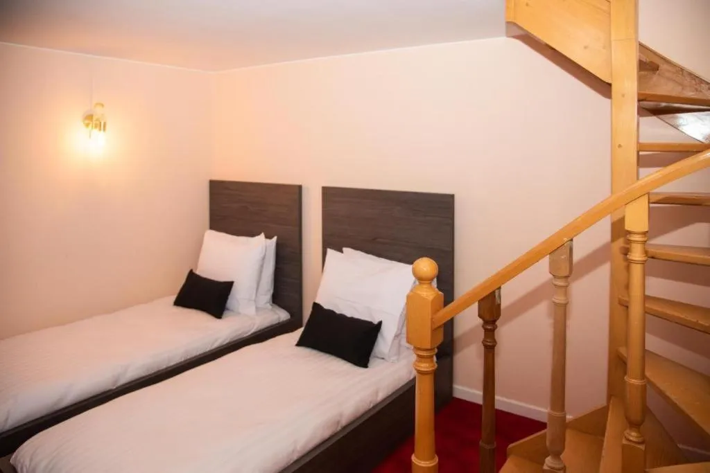 Bed in La Bourse Hotel