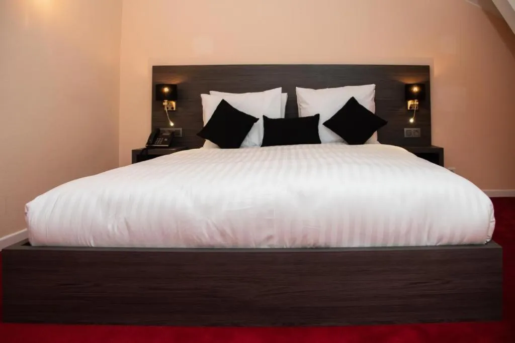 Bed in La Bourse Hotel