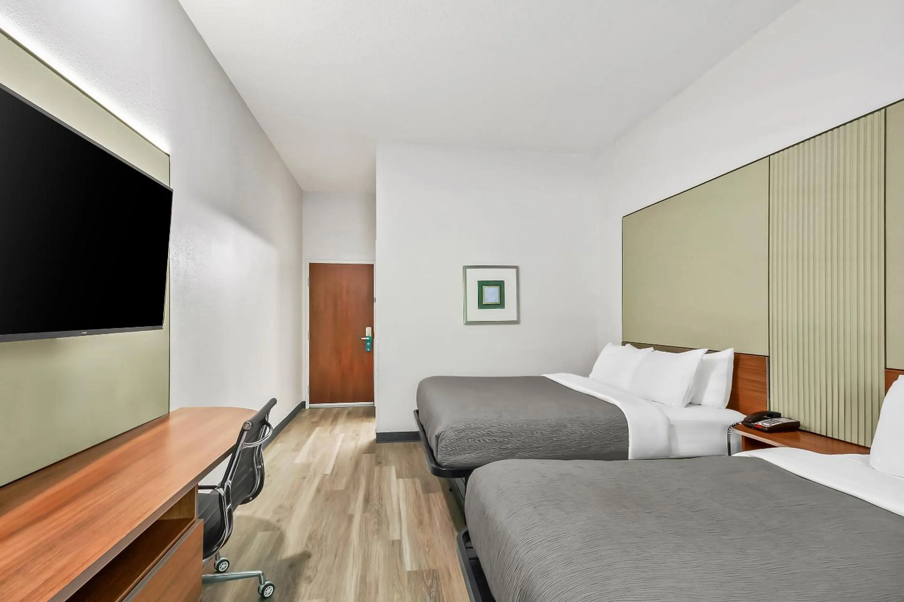 Bed in Quality Inn & Suites