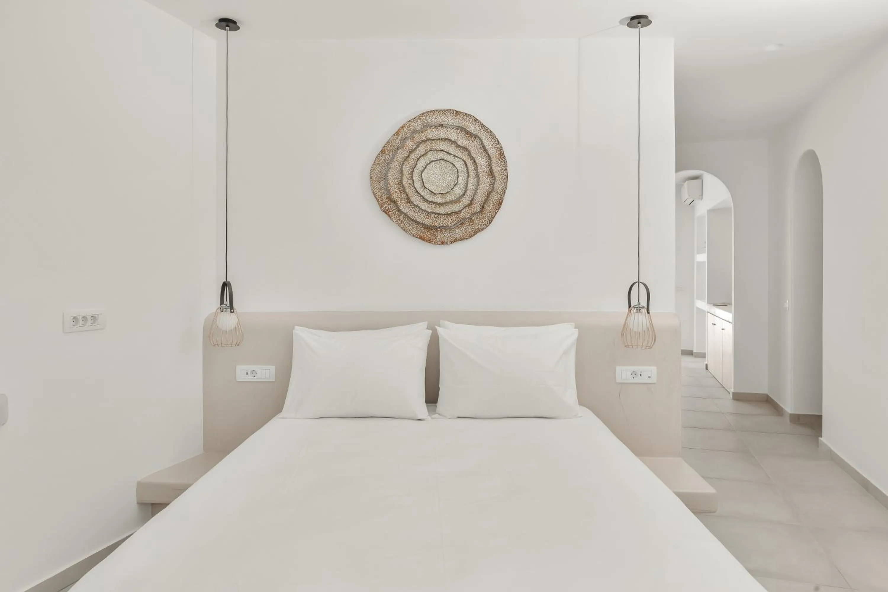 Bed in Oyster Luxury Suites