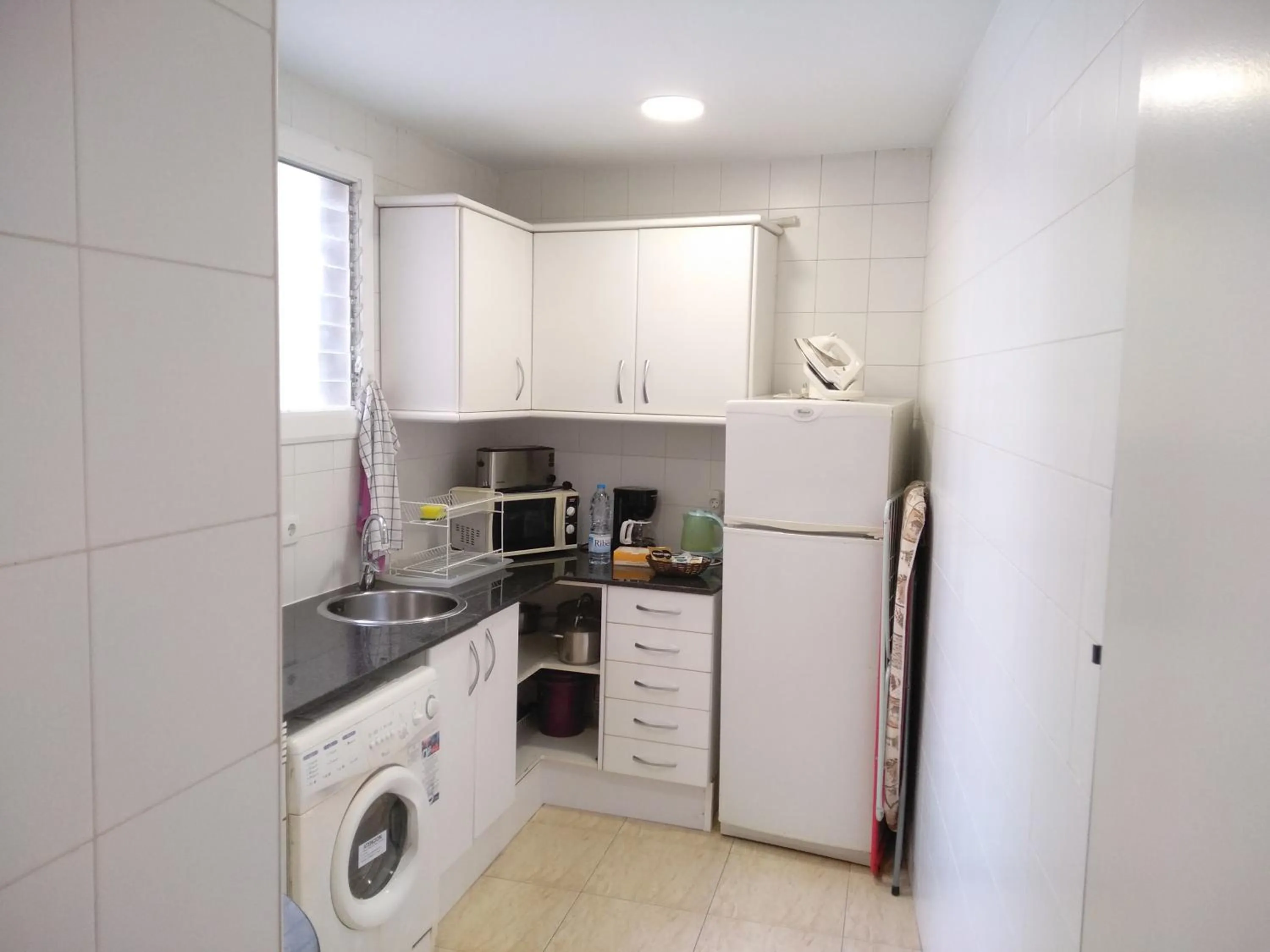 Kitchen or kitchenette in Colom Apartments