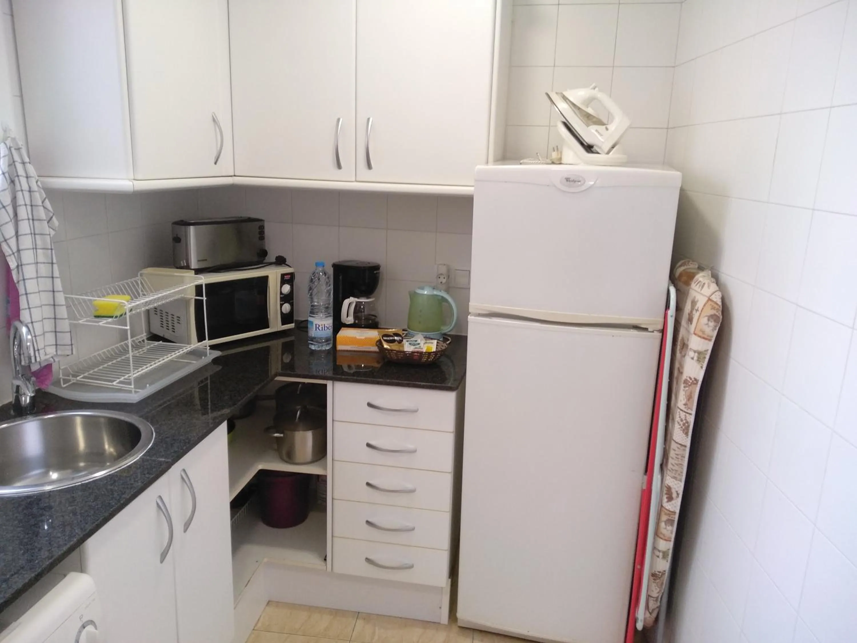Kitchen or kitchenette in Colom Apartments