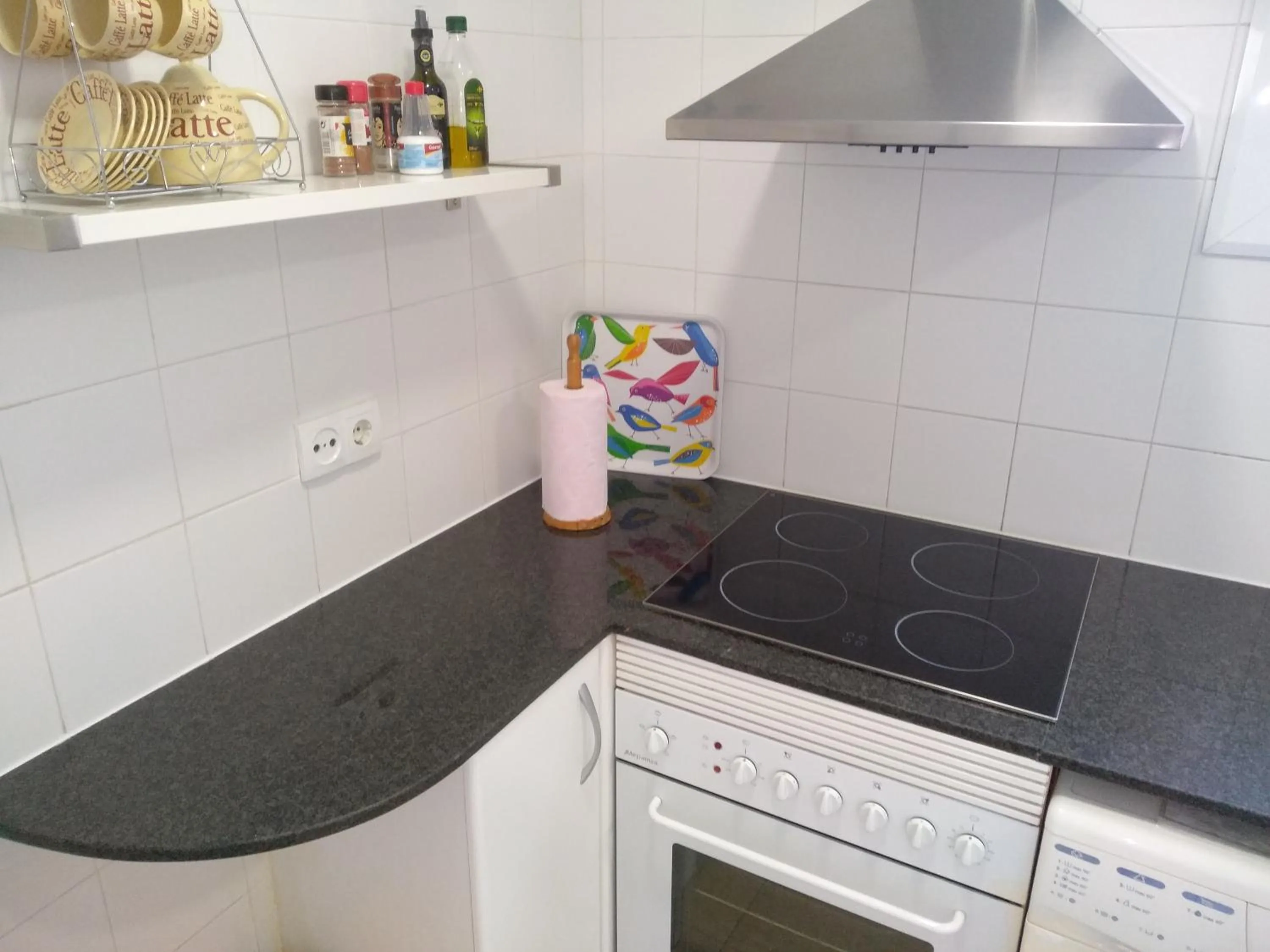 Kitchen or kitchenette in Colom Apartments