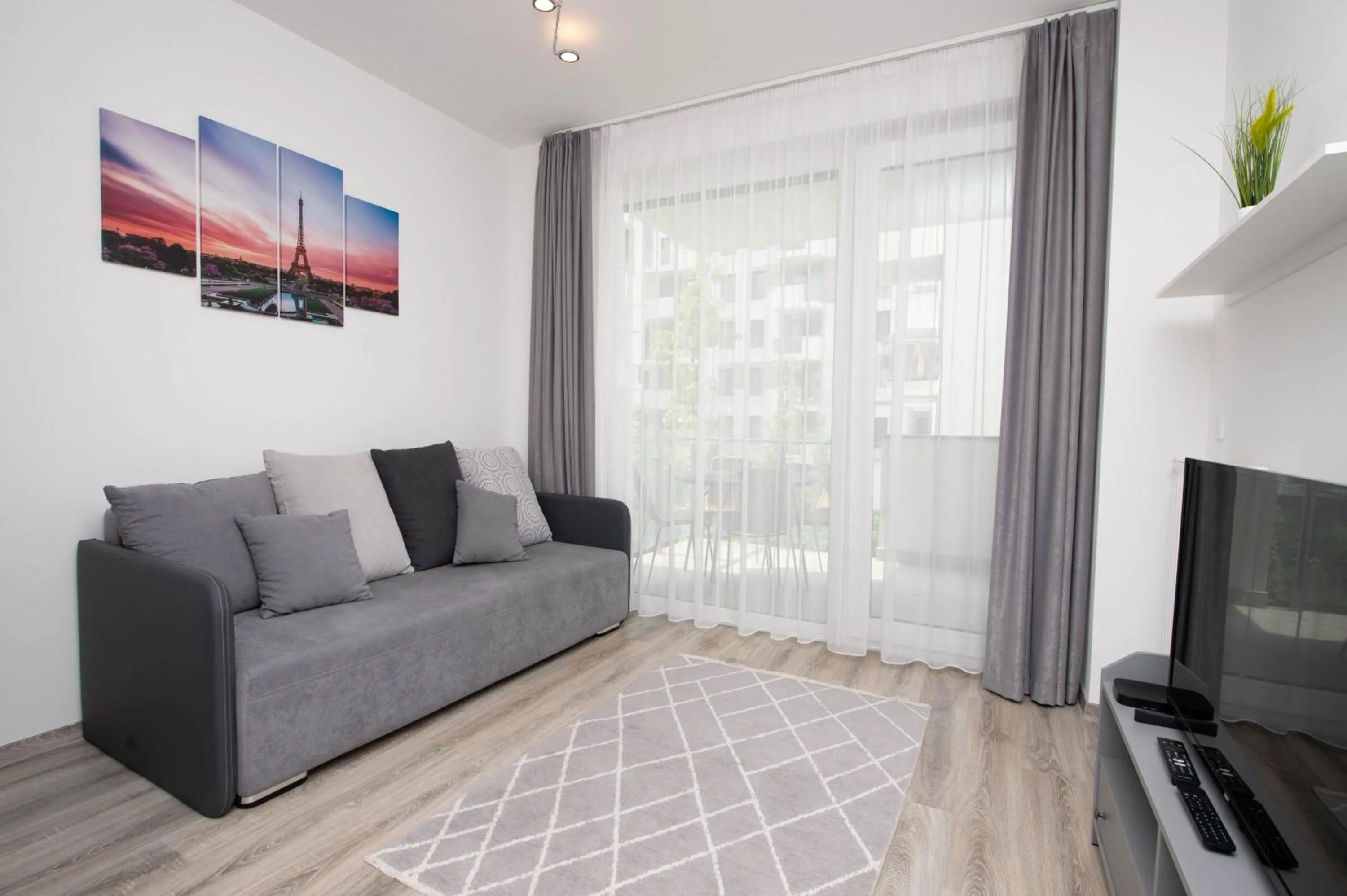 Communal lounge/ TV room in Elisabeth Downtown Apartments by FirstHost