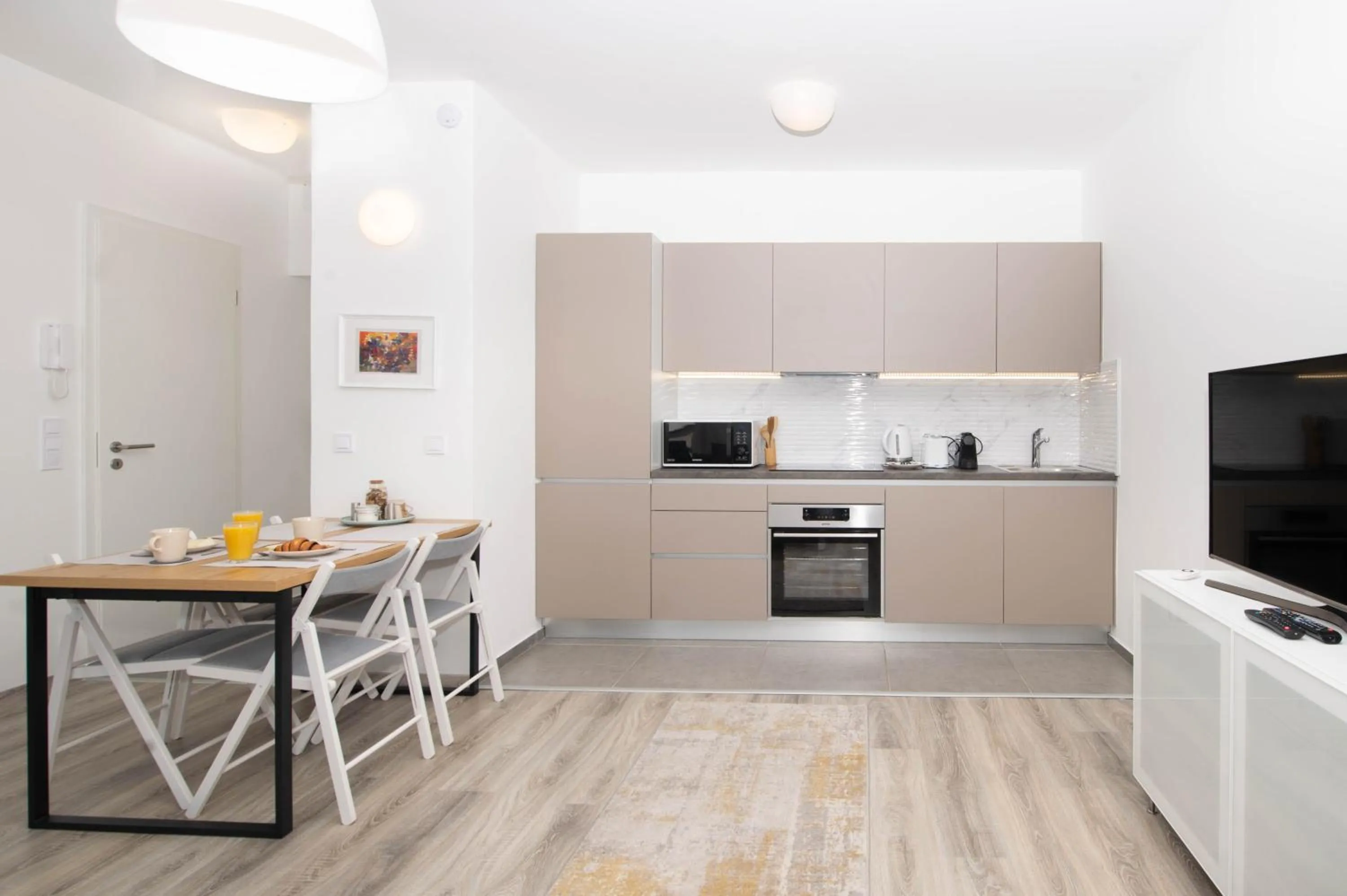 Communal lounge/ TV room in Elisabeth Downtown Apartments by FirstHost