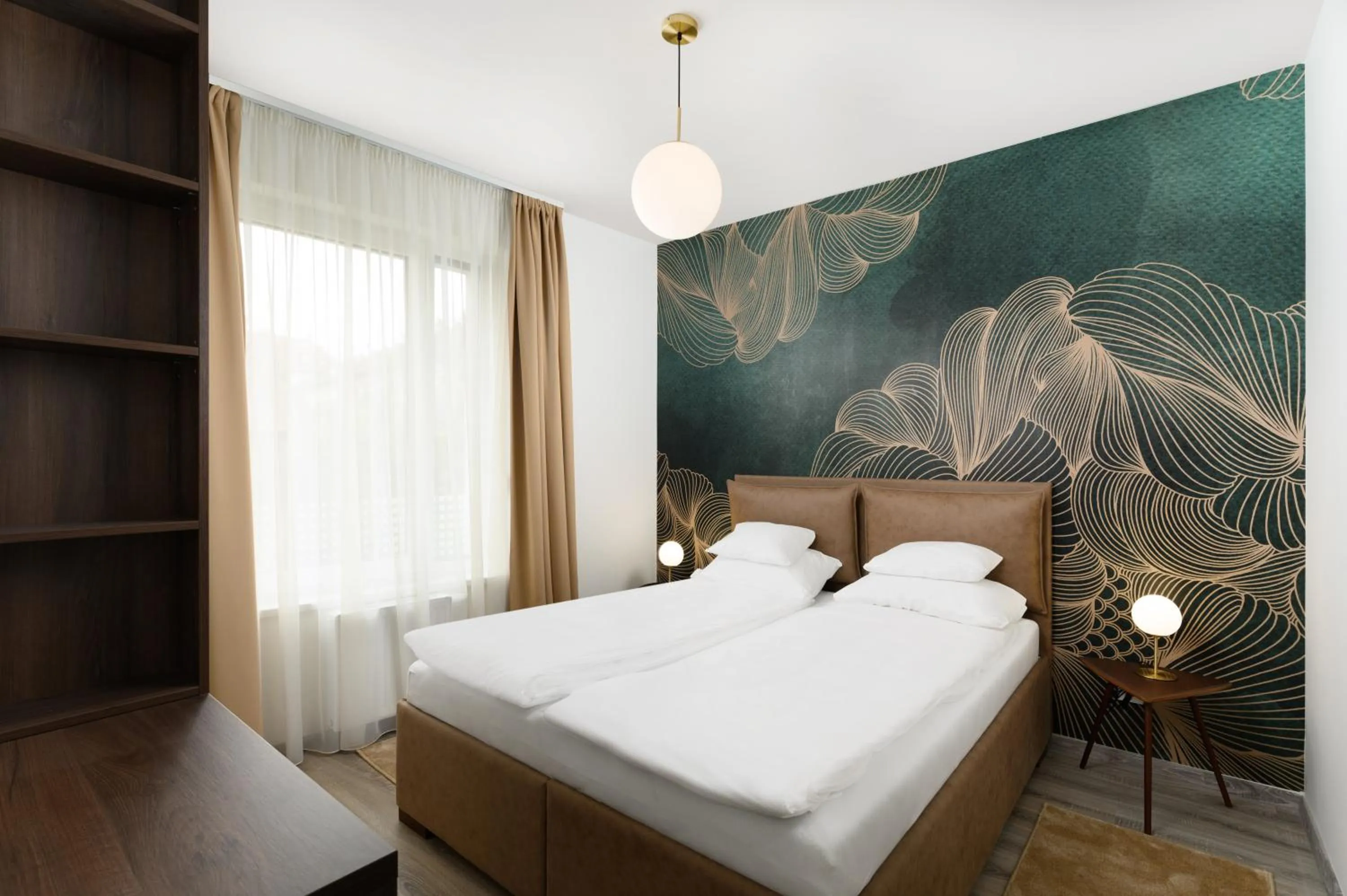 Bed in Elisabeth Downtown Apartments by FirstHost