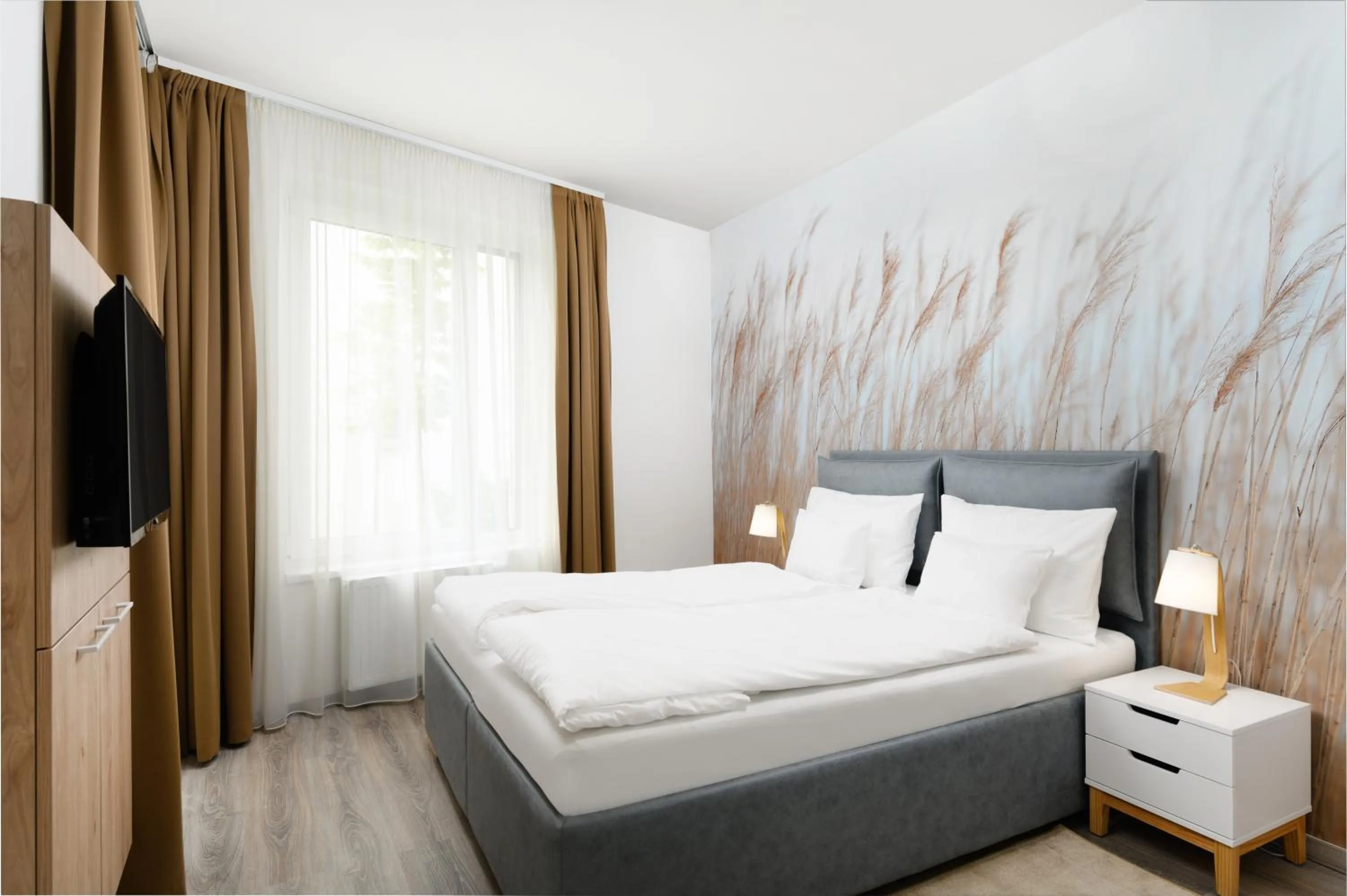 Bed in Elisabeth Downtown Apartments by FirstHost