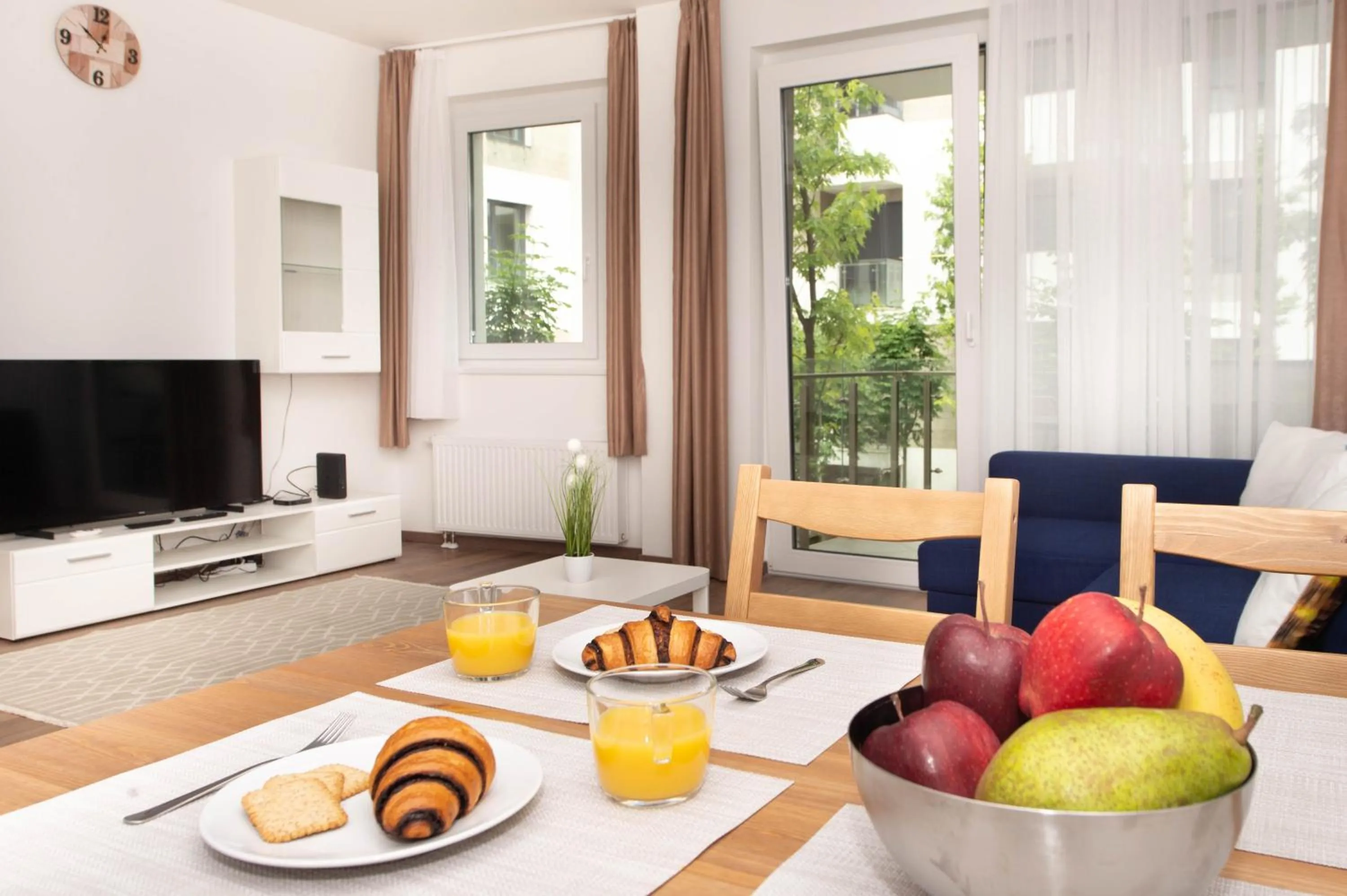 Communal lounge/ TV room in Elisabeth Downtown Apartments by FirstHost