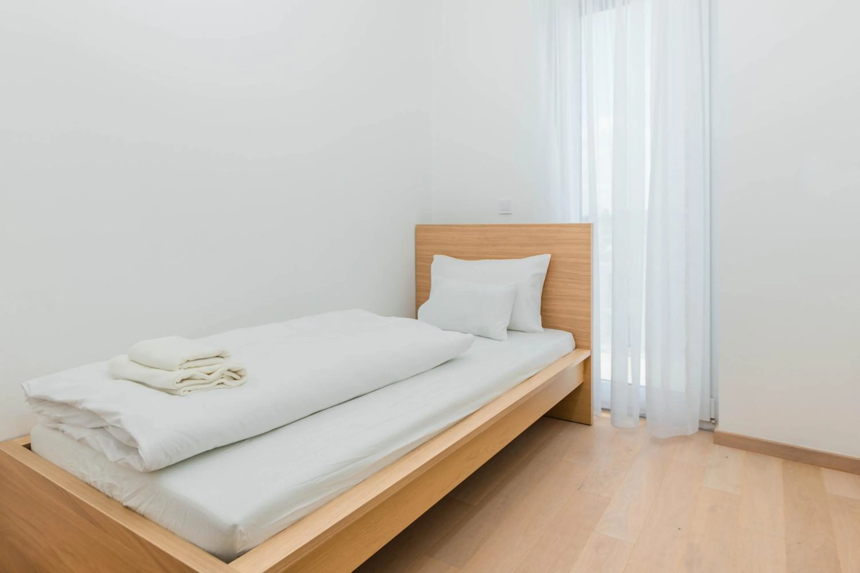 Bed in Elisabeth Downtown Apartments by FirstHost