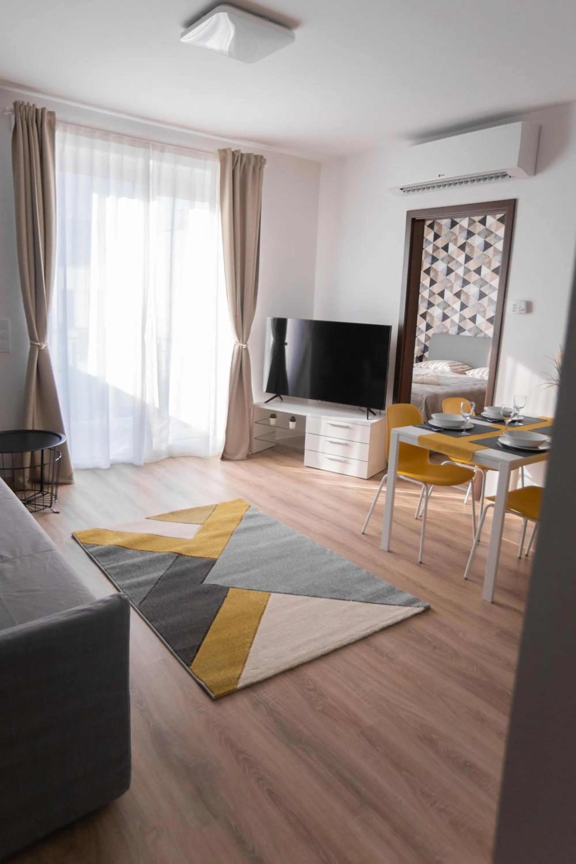 Communal lounge/ TV room in Elisabeth Downtown Apartments by FirstHost