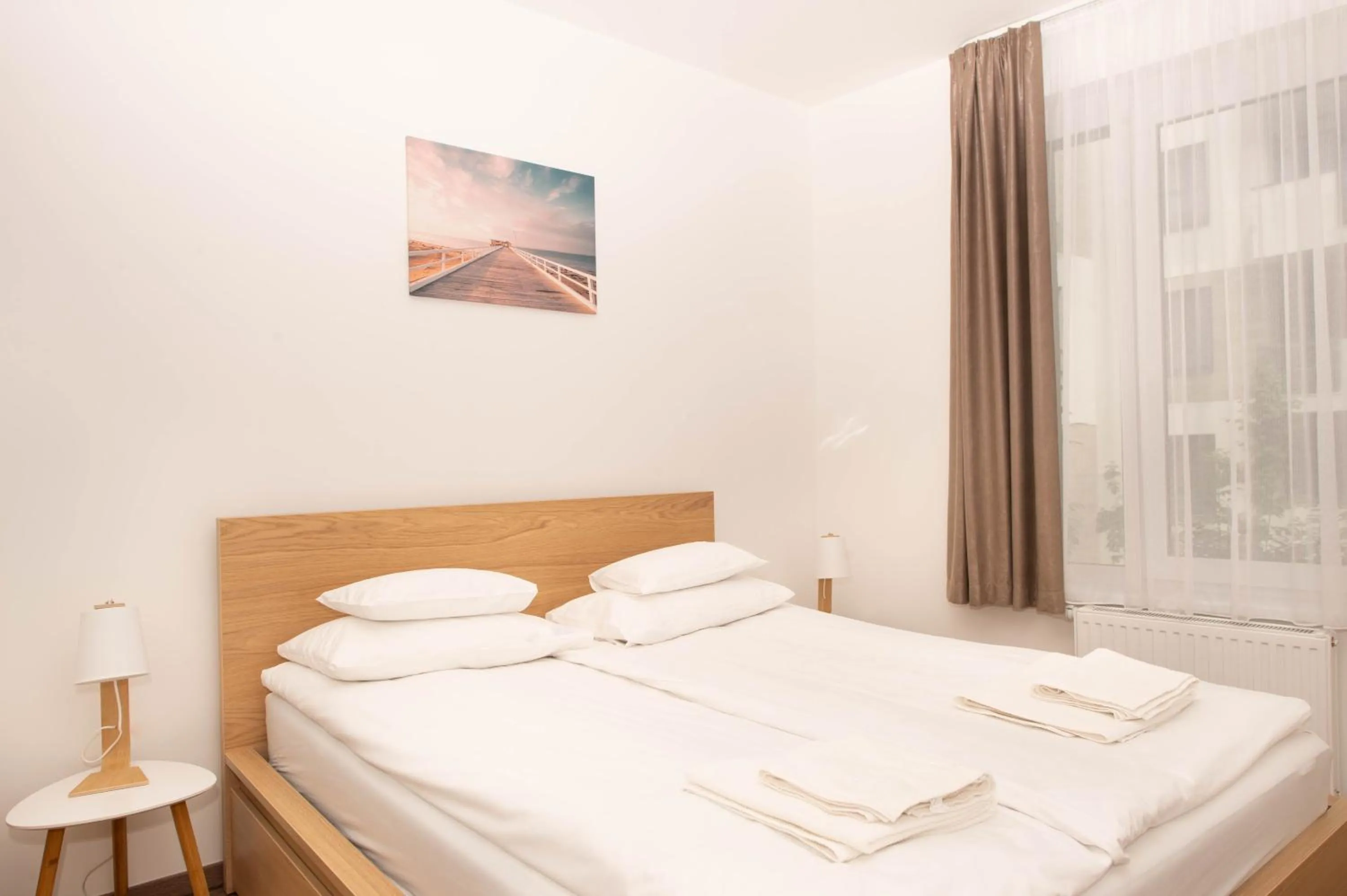 Bed in Elisabeth Downtown Apartments by FirstHost