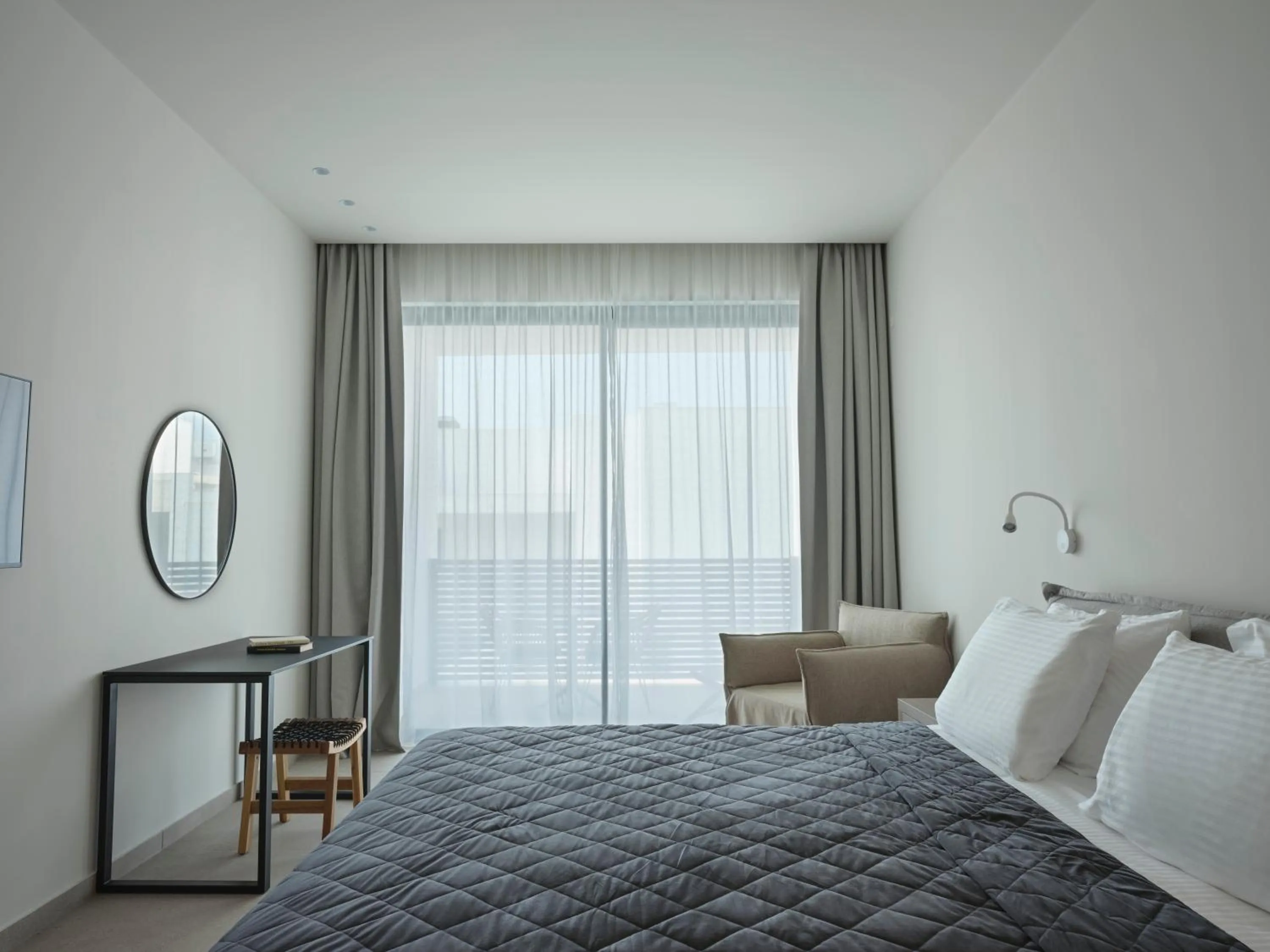 Bed in Atlantica Sancta Napa Hotel