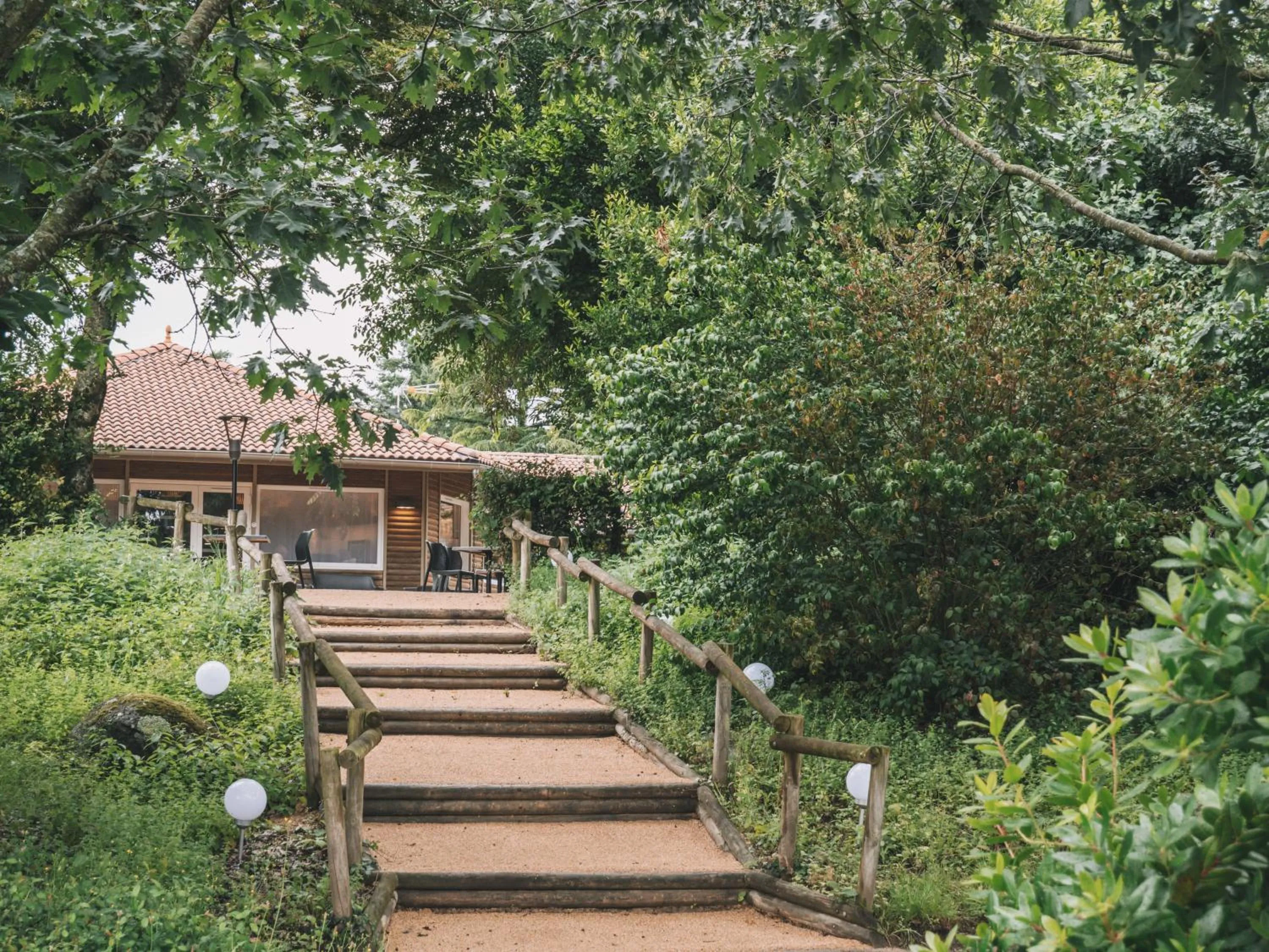 Garden in Logis hôtels Le Saint Pierre