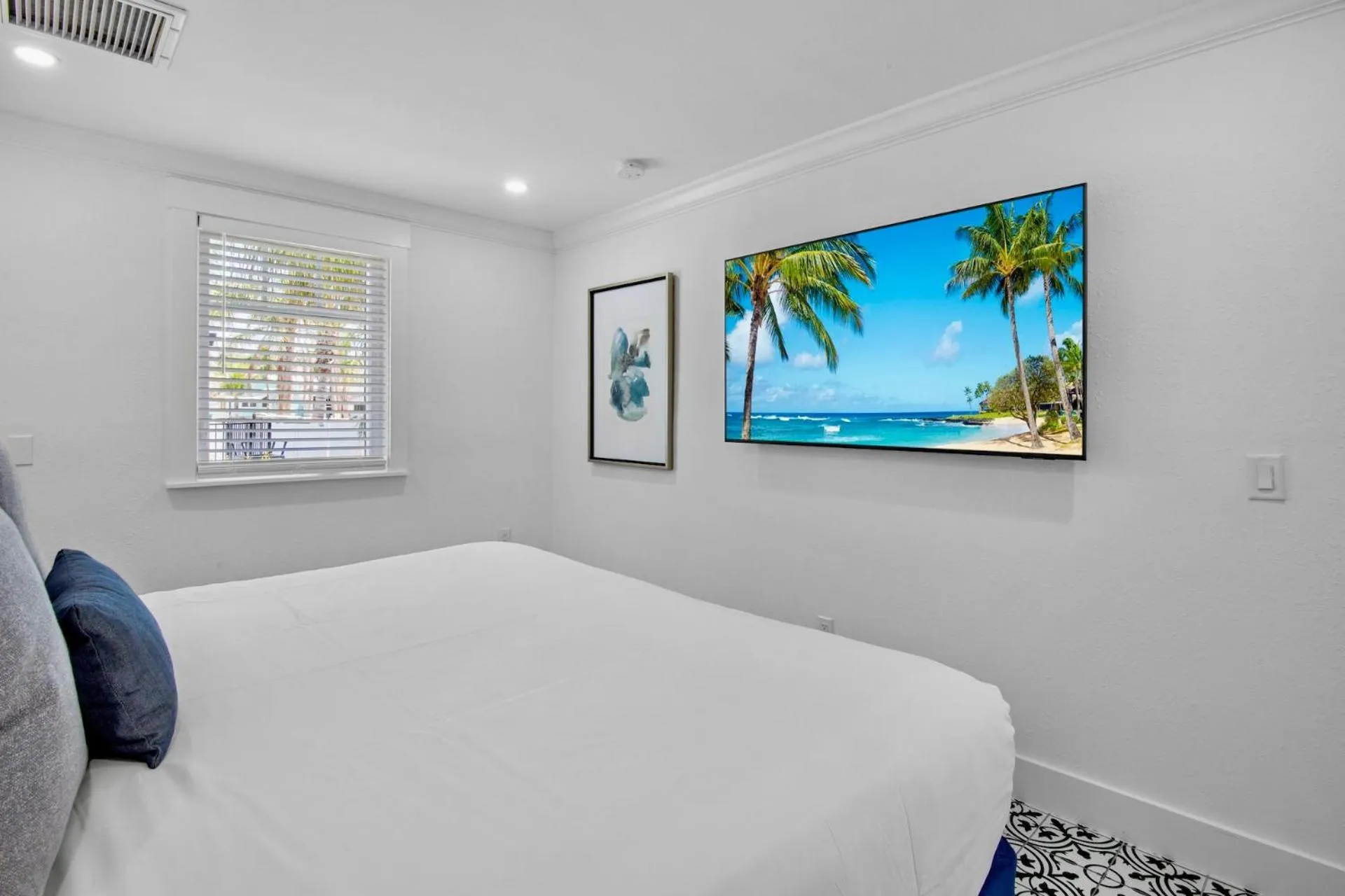 Bed in Pelican Post at Anna Maria Island Inn