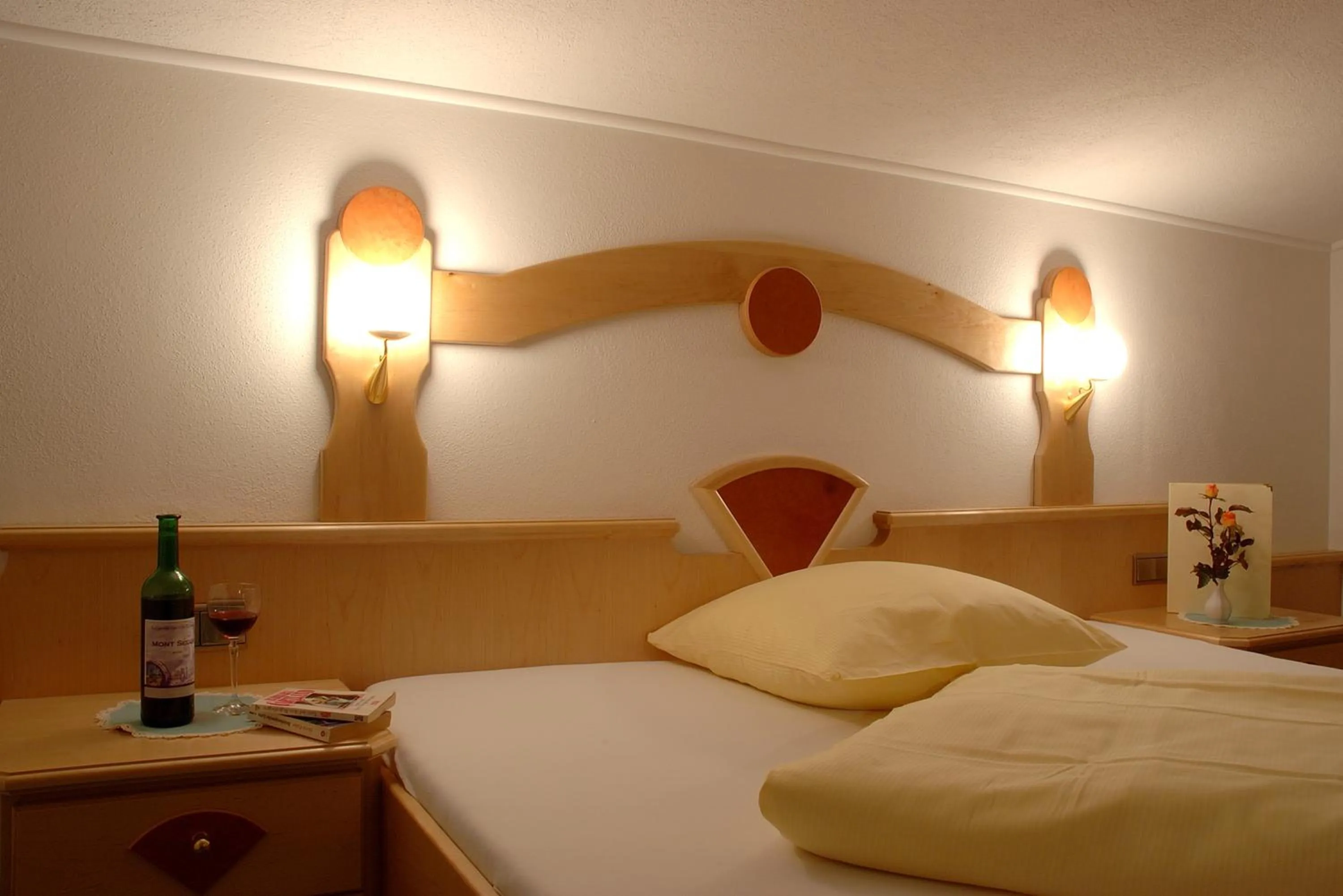 Bedroom, Bed in Alpenherz Hotel Garni