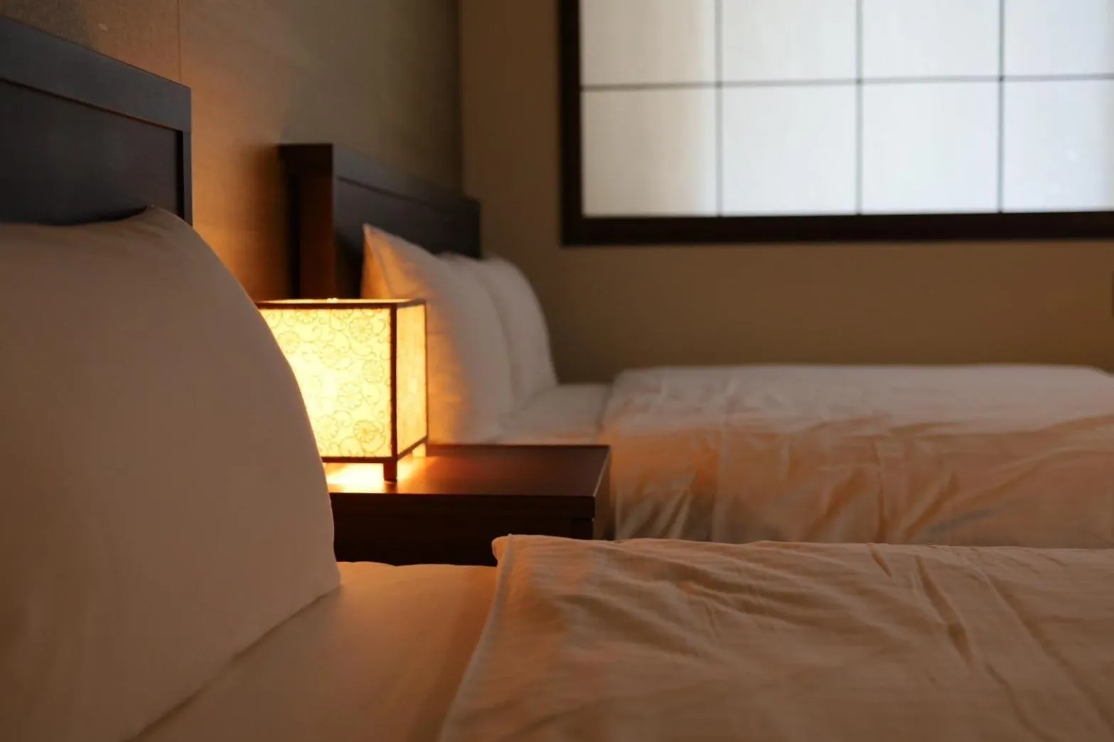 Bed in Hotel Rakurakuan