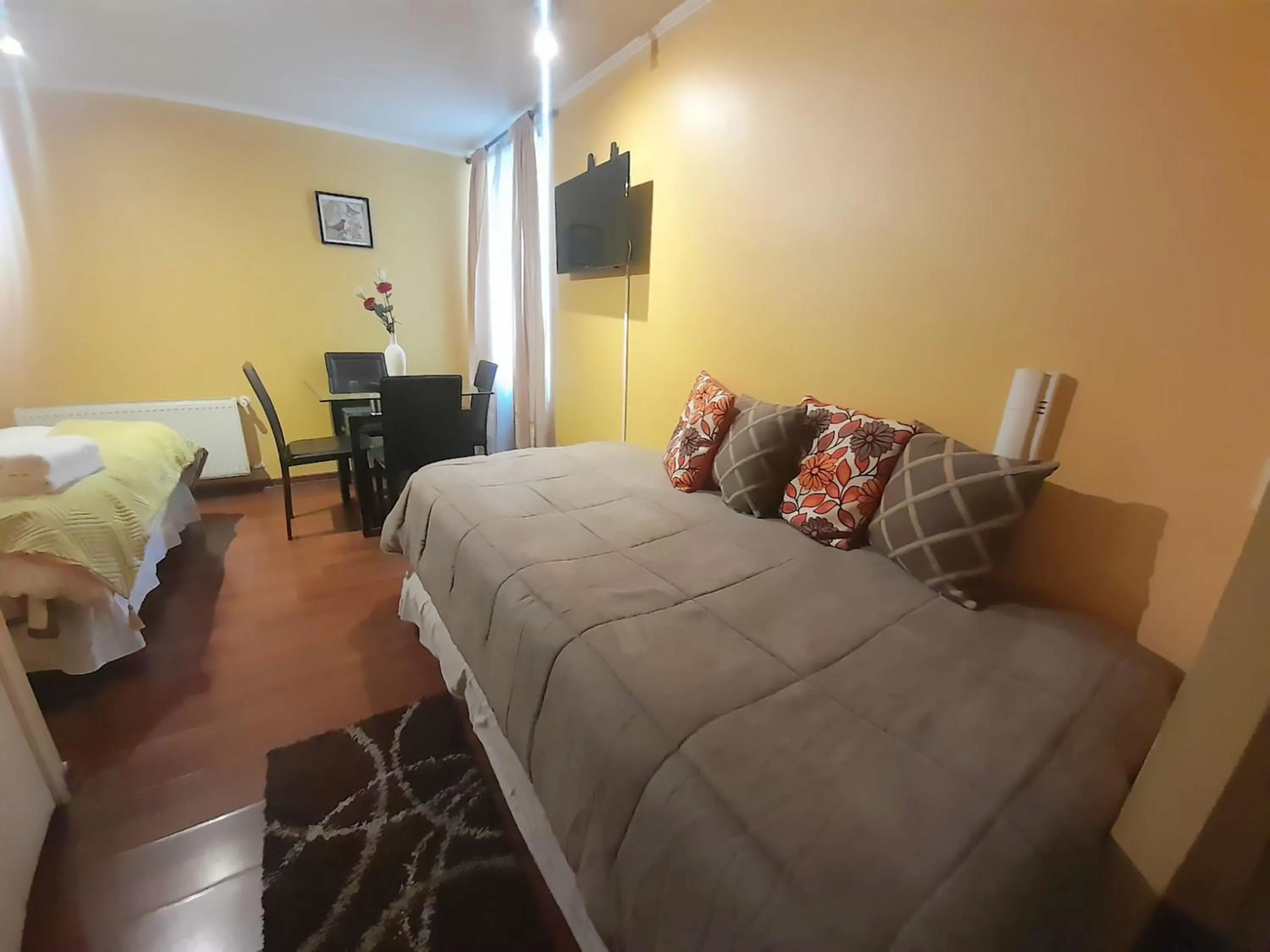 Seating area, Bed in VIP Apartments Chile