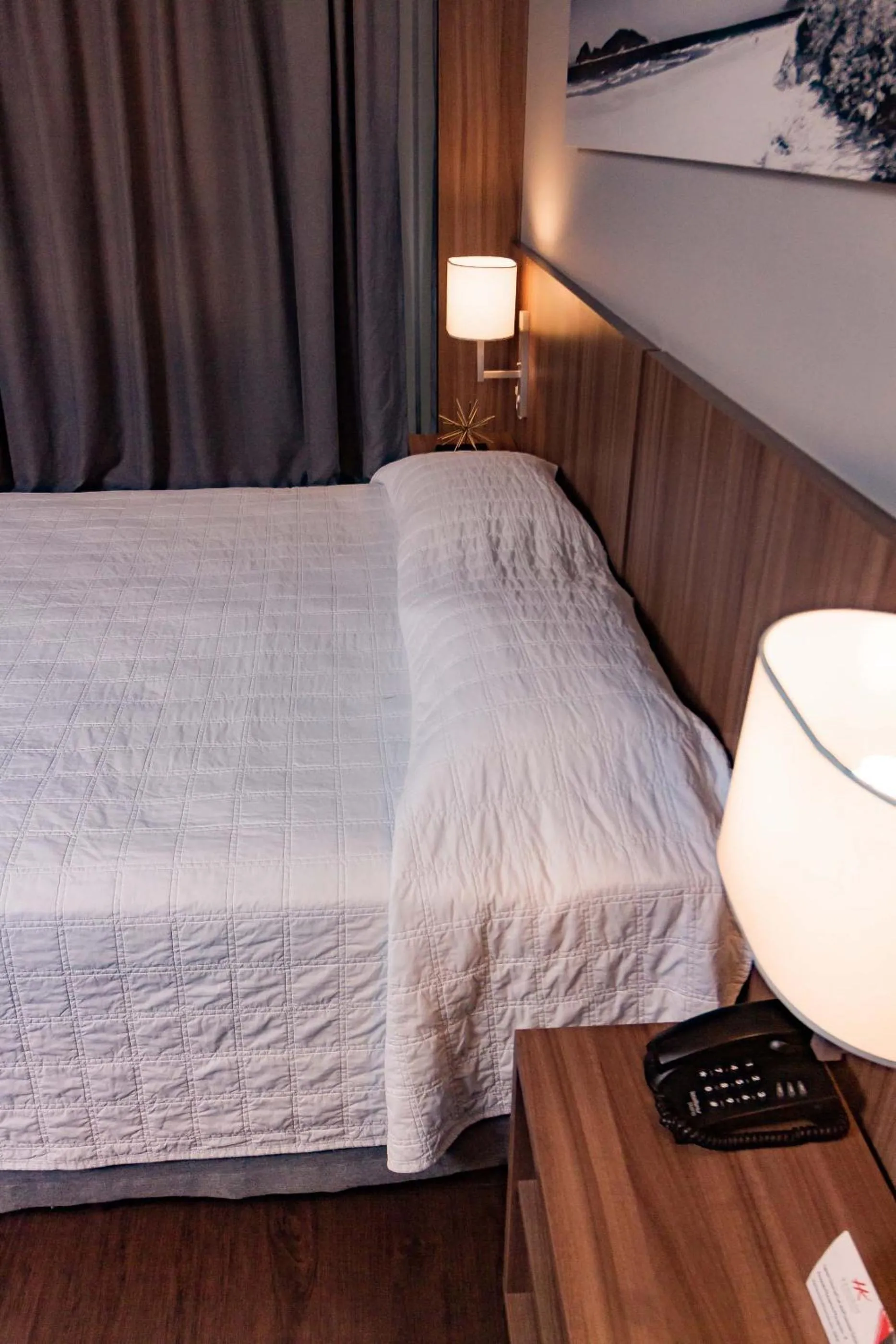 Bed in Kennedy Executive Hotel