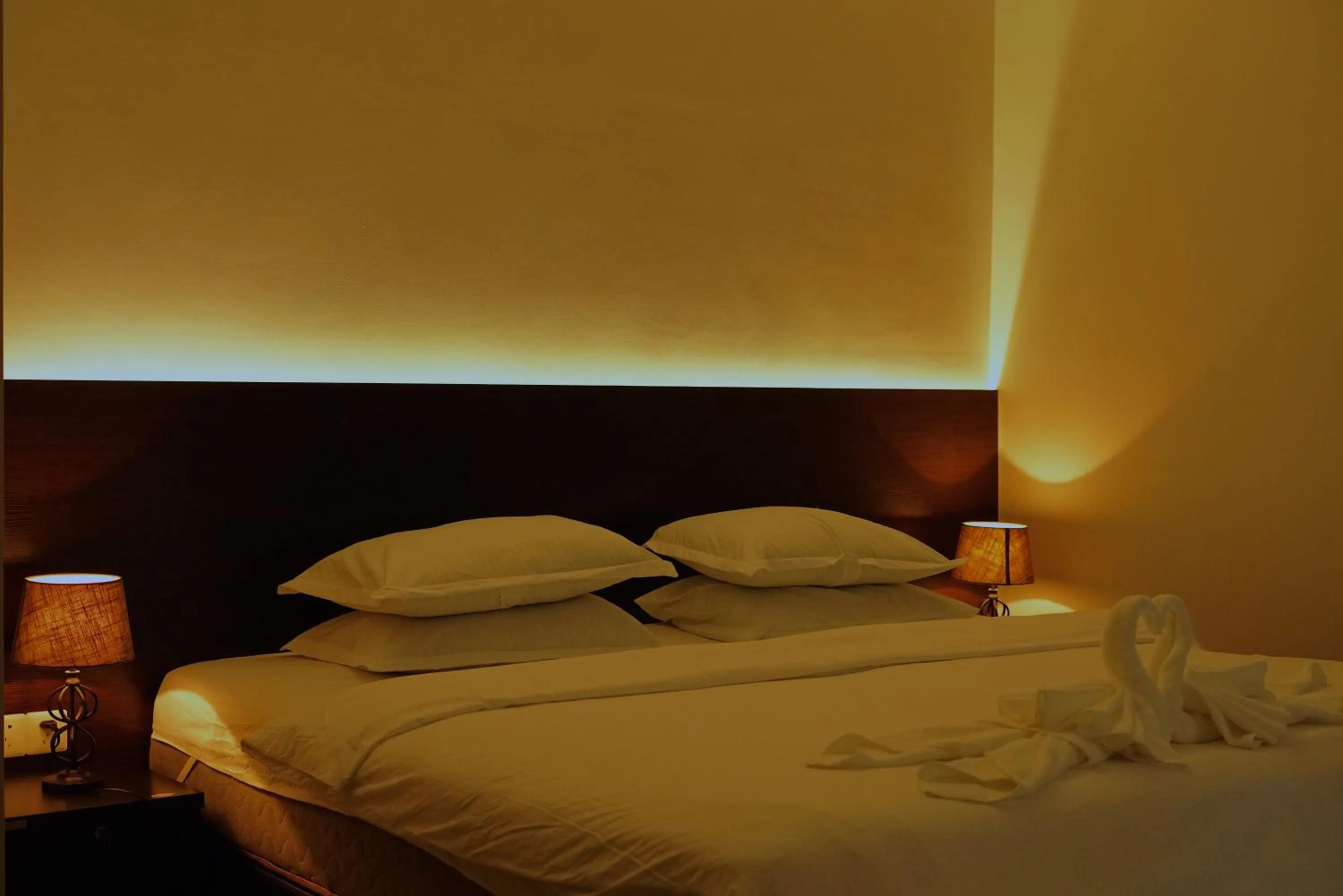 Bed in Violet Inn Hotel