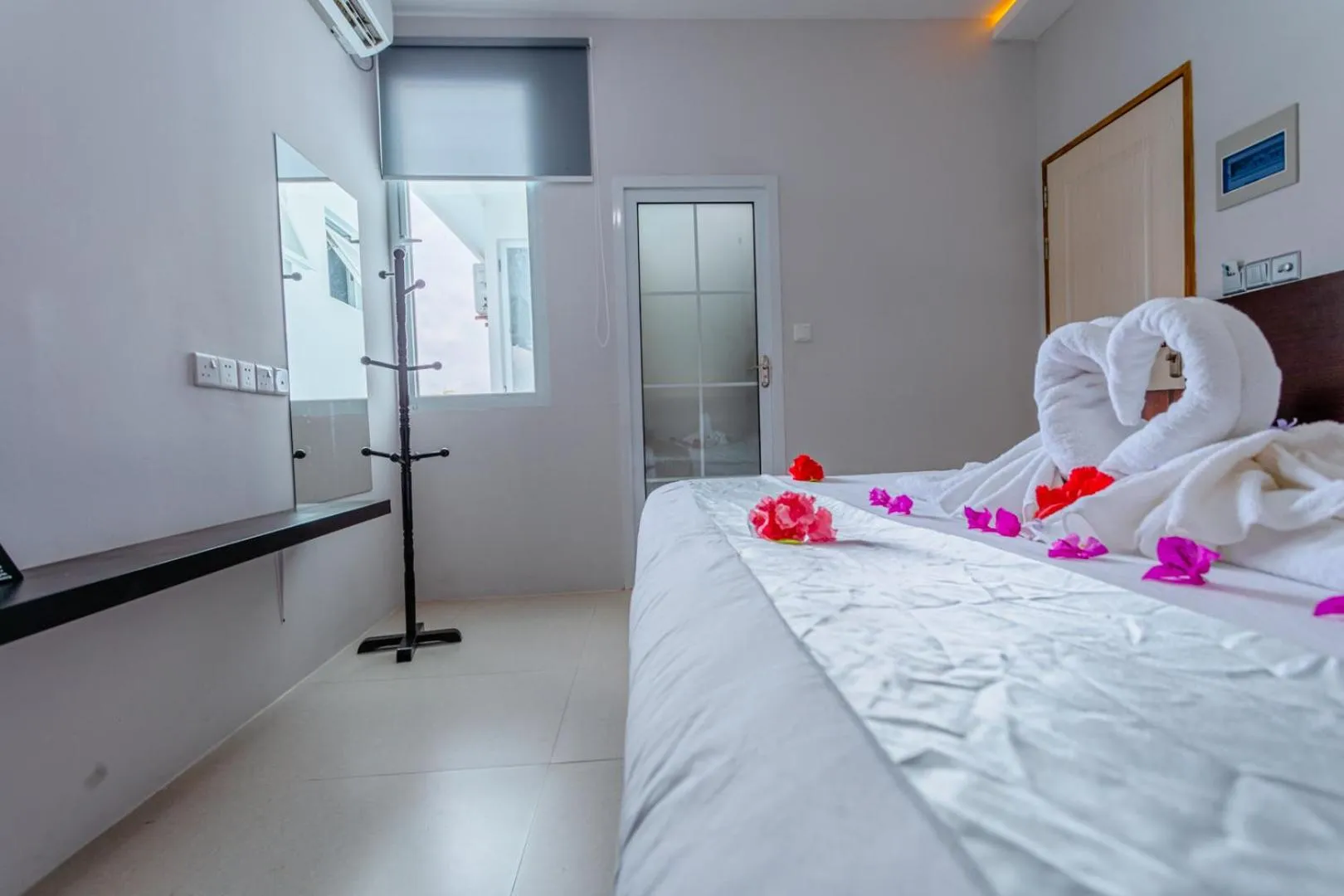 Bed in Violet Inn Hotel