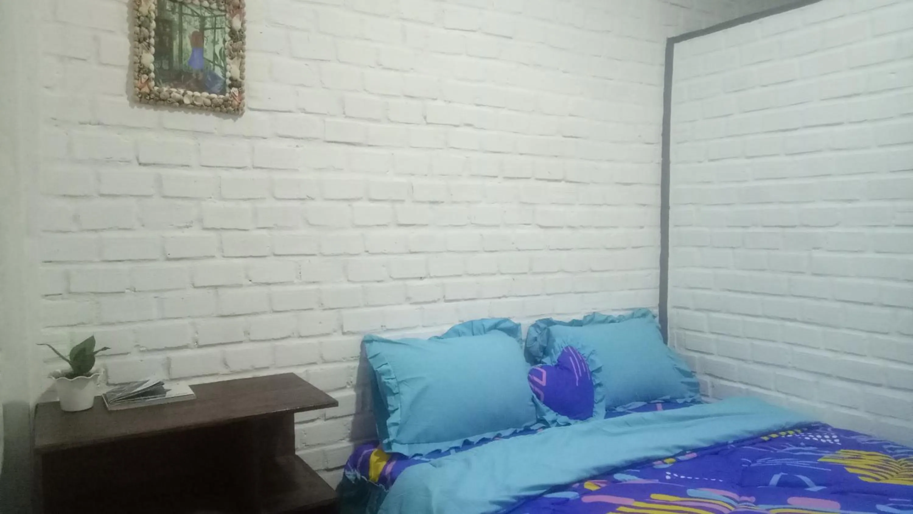 Bedroom in AZALEA GARDEN HOMESTAY