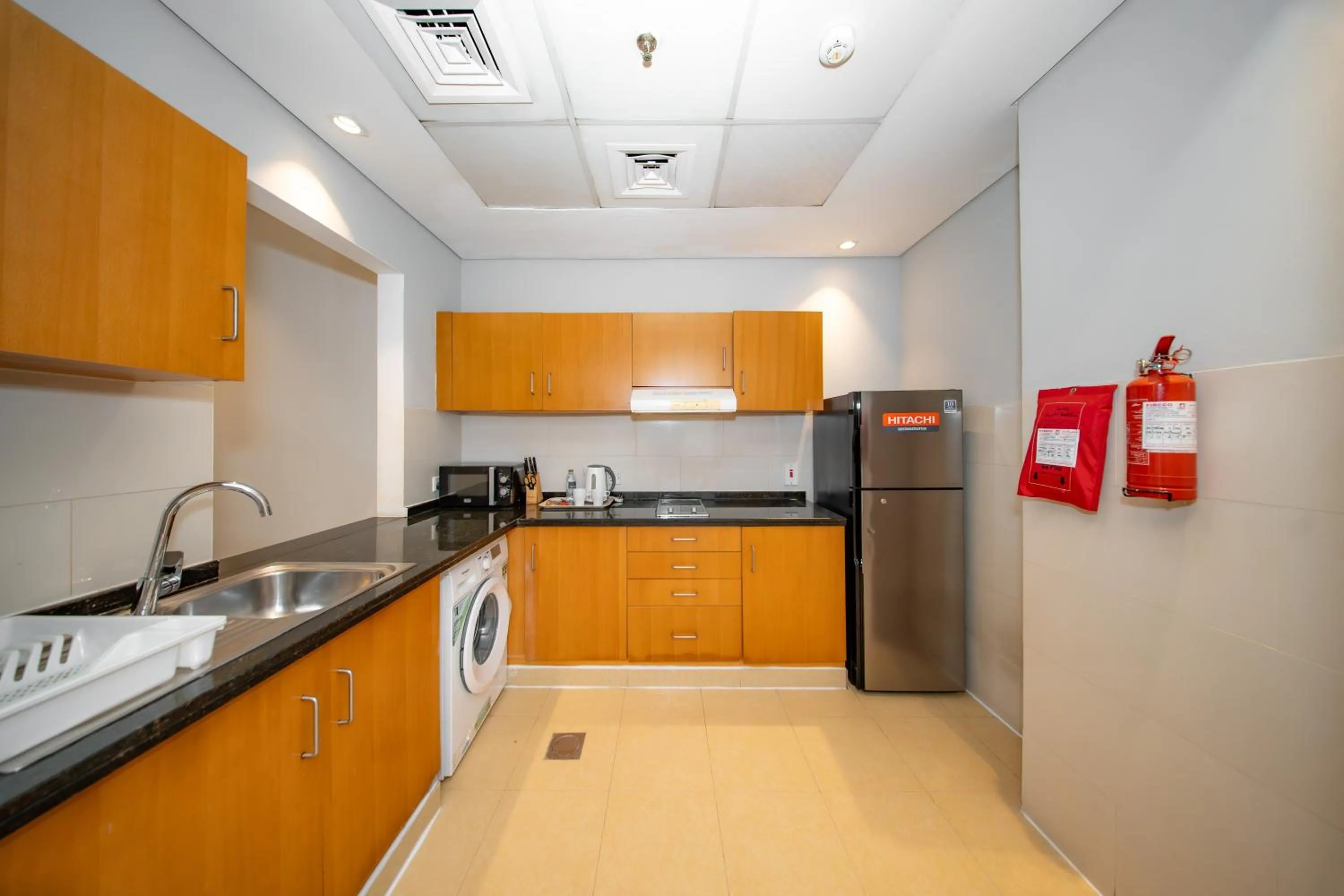 Kitchen or kitchenette in City Stay Grand Hotel Apartments - Al Barsha