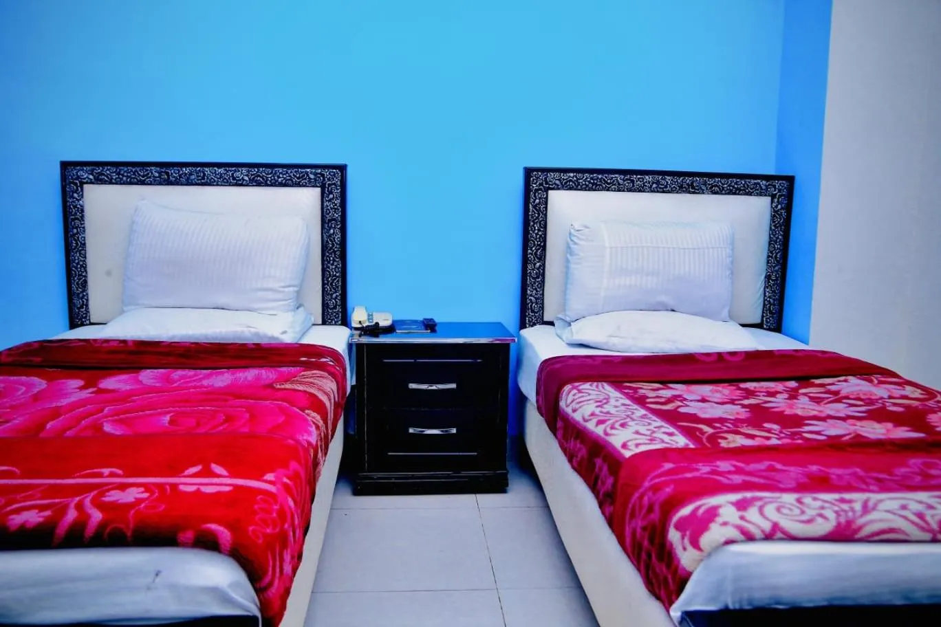 Bed in Hotel Tulip Inn