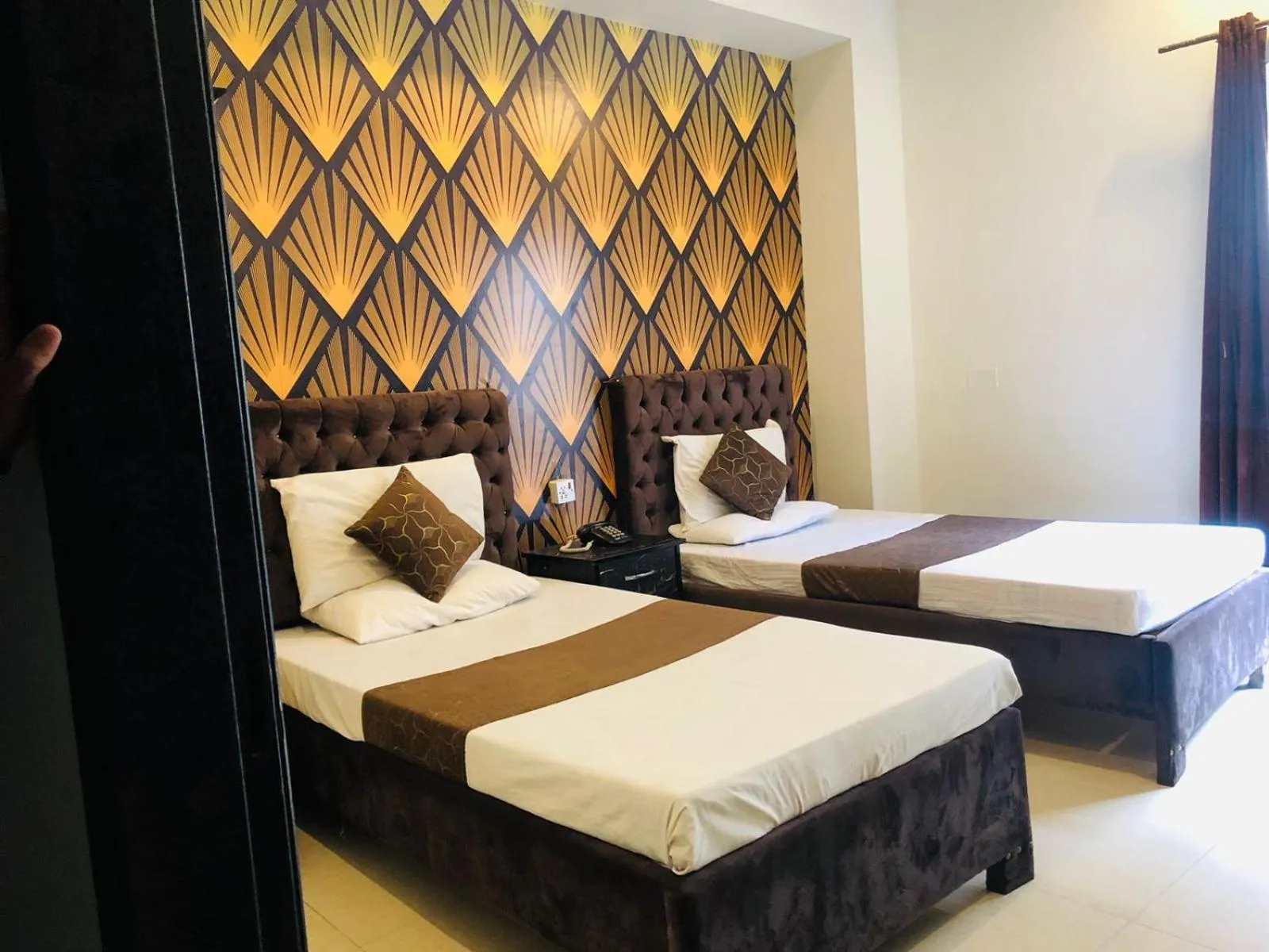 Bed in Hotel Tulip Inn