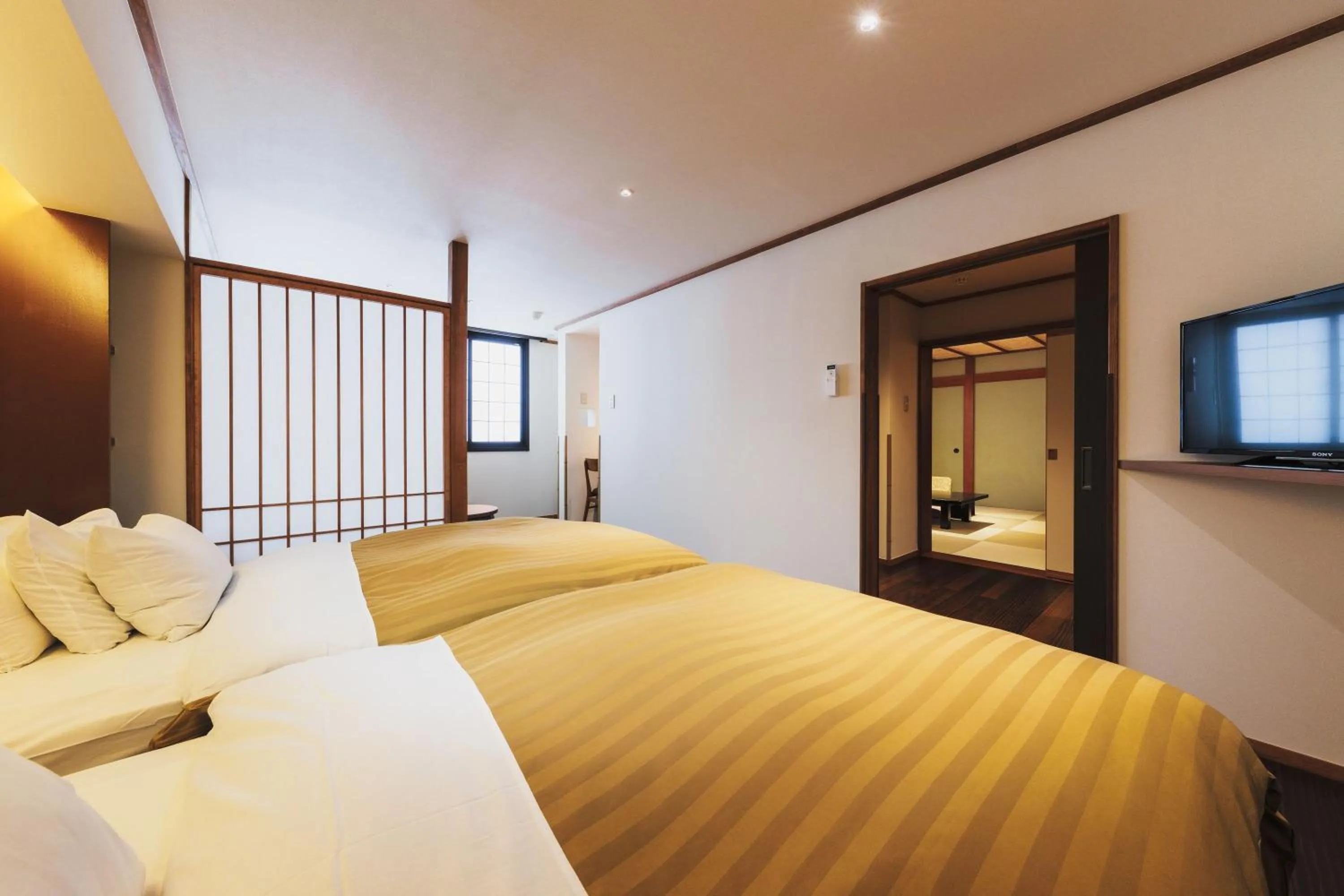 Bed in Takamiya Ryokan Miyamaso