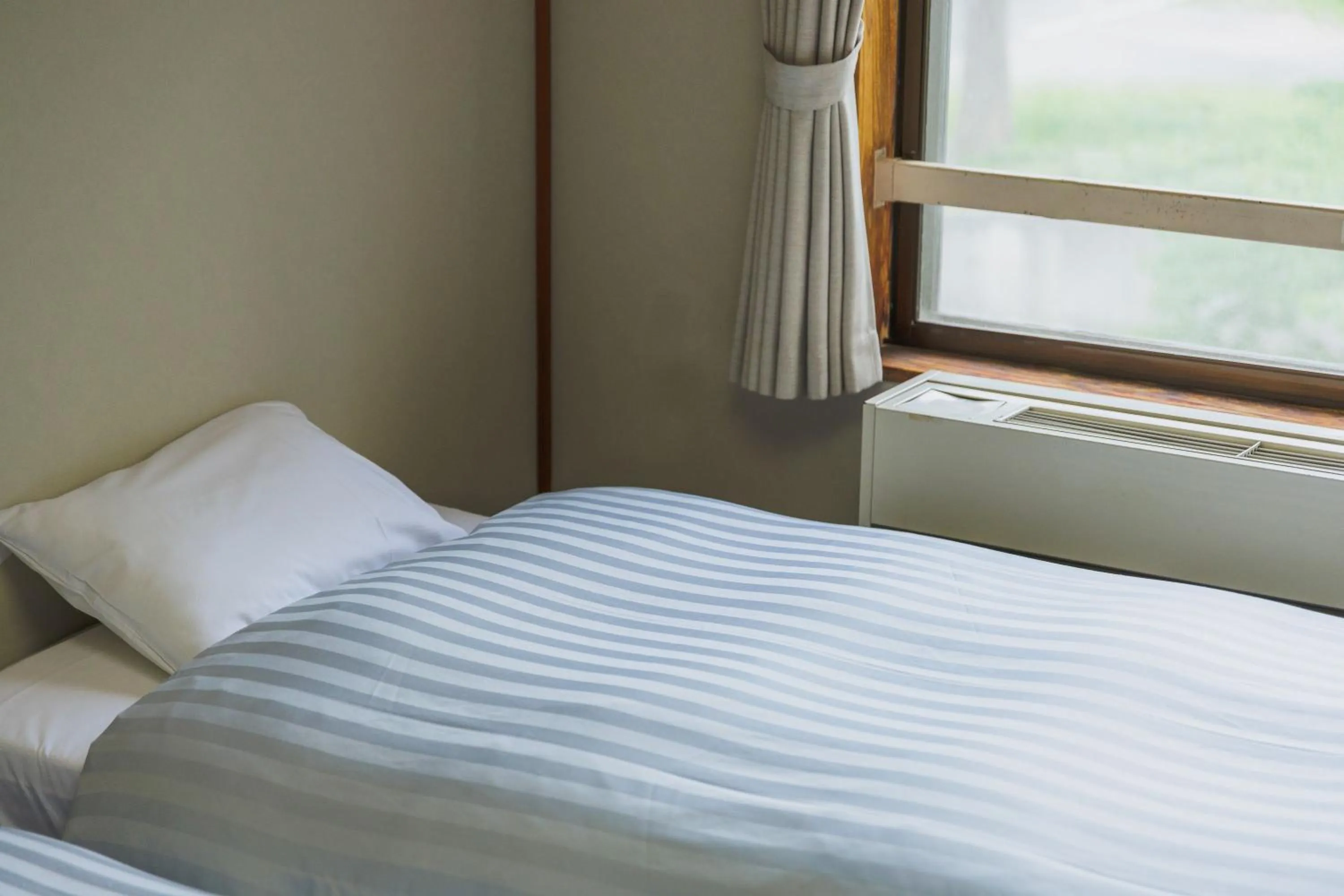 Bed in Takamiya Hotel Hammond