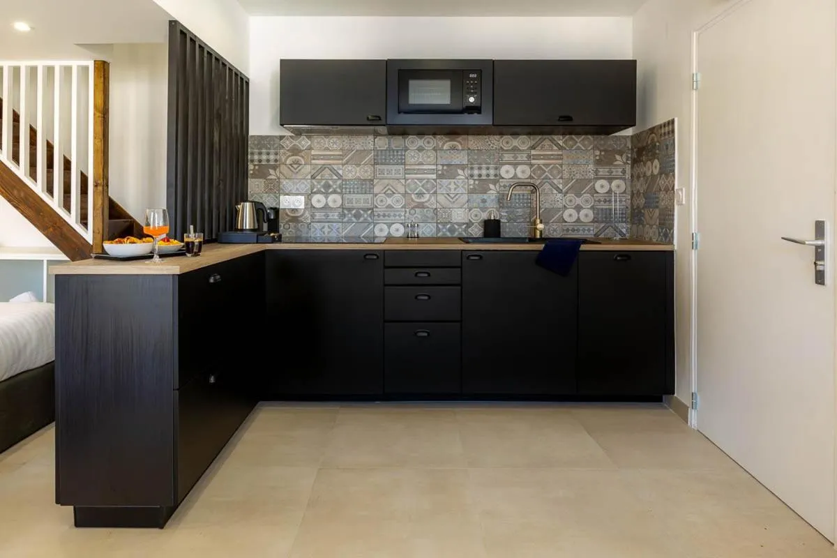 Kitchen or kitchenette in Provence Au Coeur Appart Hotels