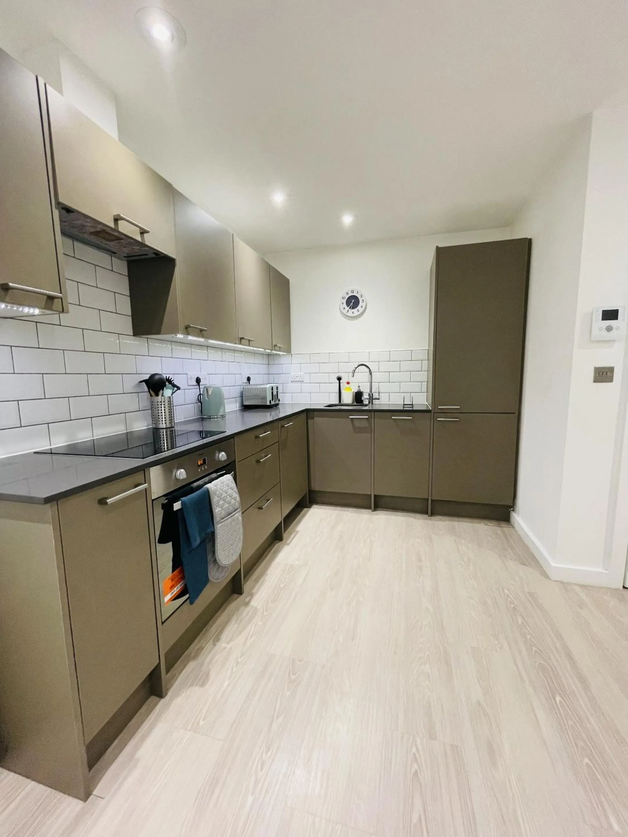Kitchen or kitchenette in Southernhay Court Apartments by Staytor Accommodation