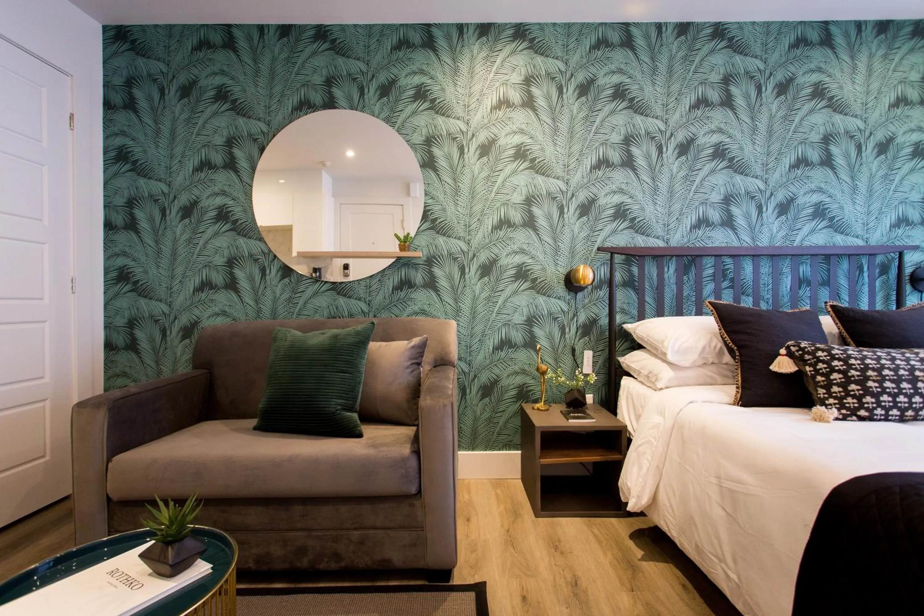 Bed in Blue Tropics Studio in Little Italy with kitchen by Den Stays