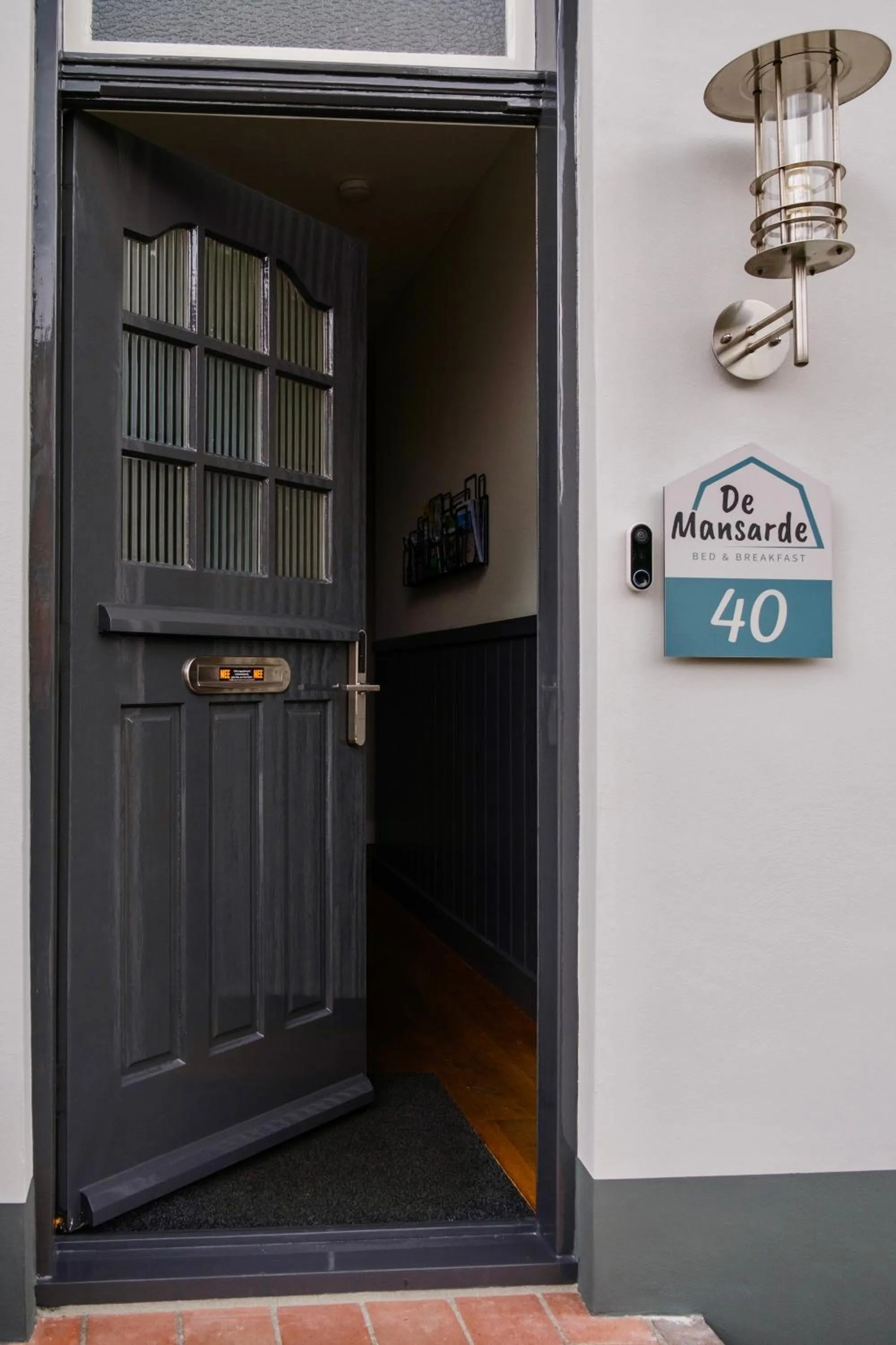 Facade/entrance in B&B De Mansarde