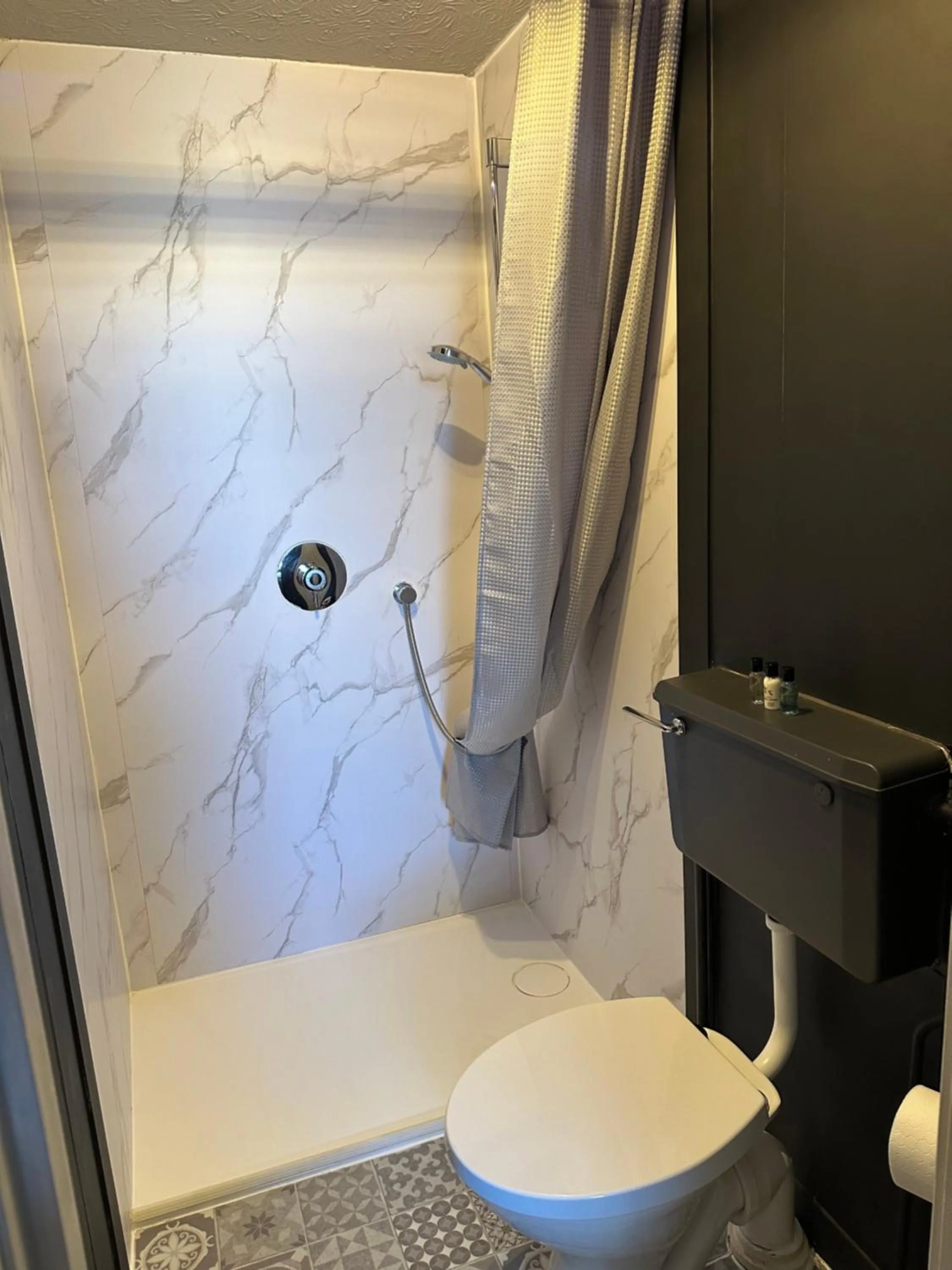 Shower in The Q Hotel