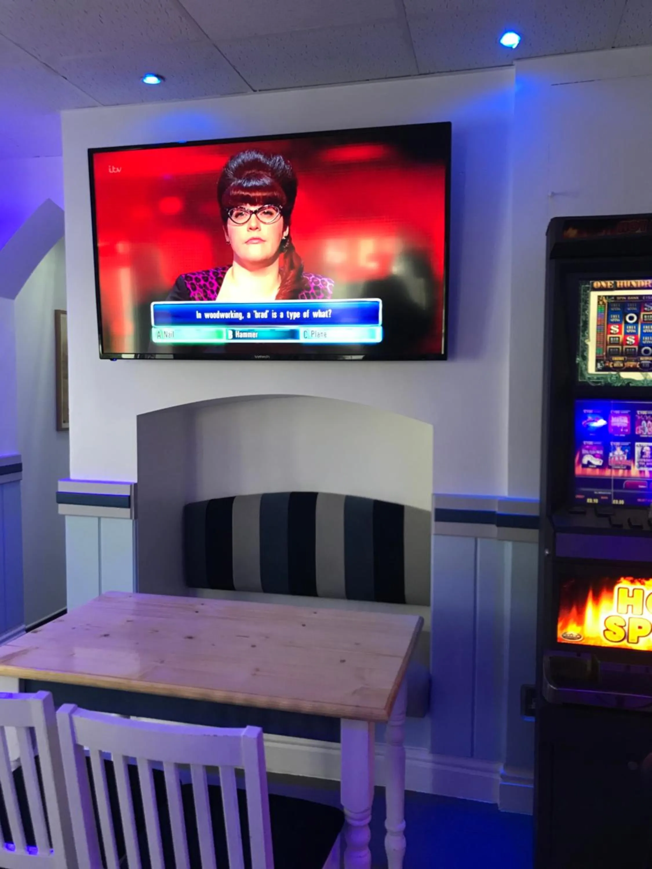 Communal lounge/ TV room in The Wellington House Hotel