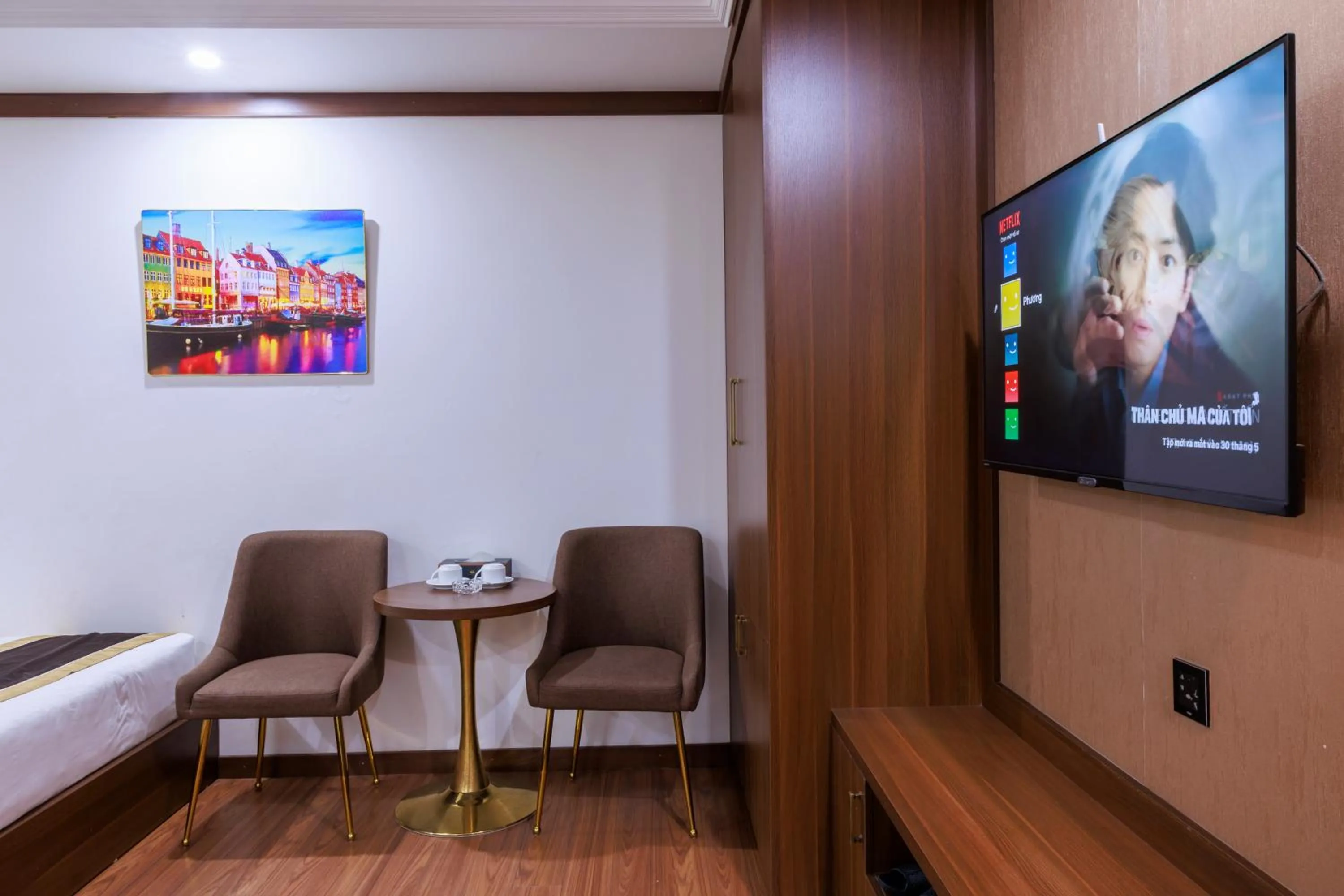 Communal lounge/ TV room in New Sun Móng Cái Hotel