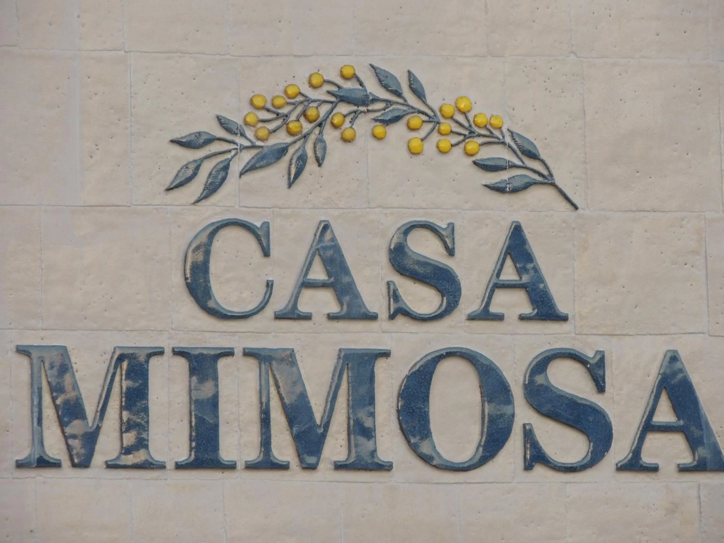 Property logo or sign in Casa Mimosa Hotel