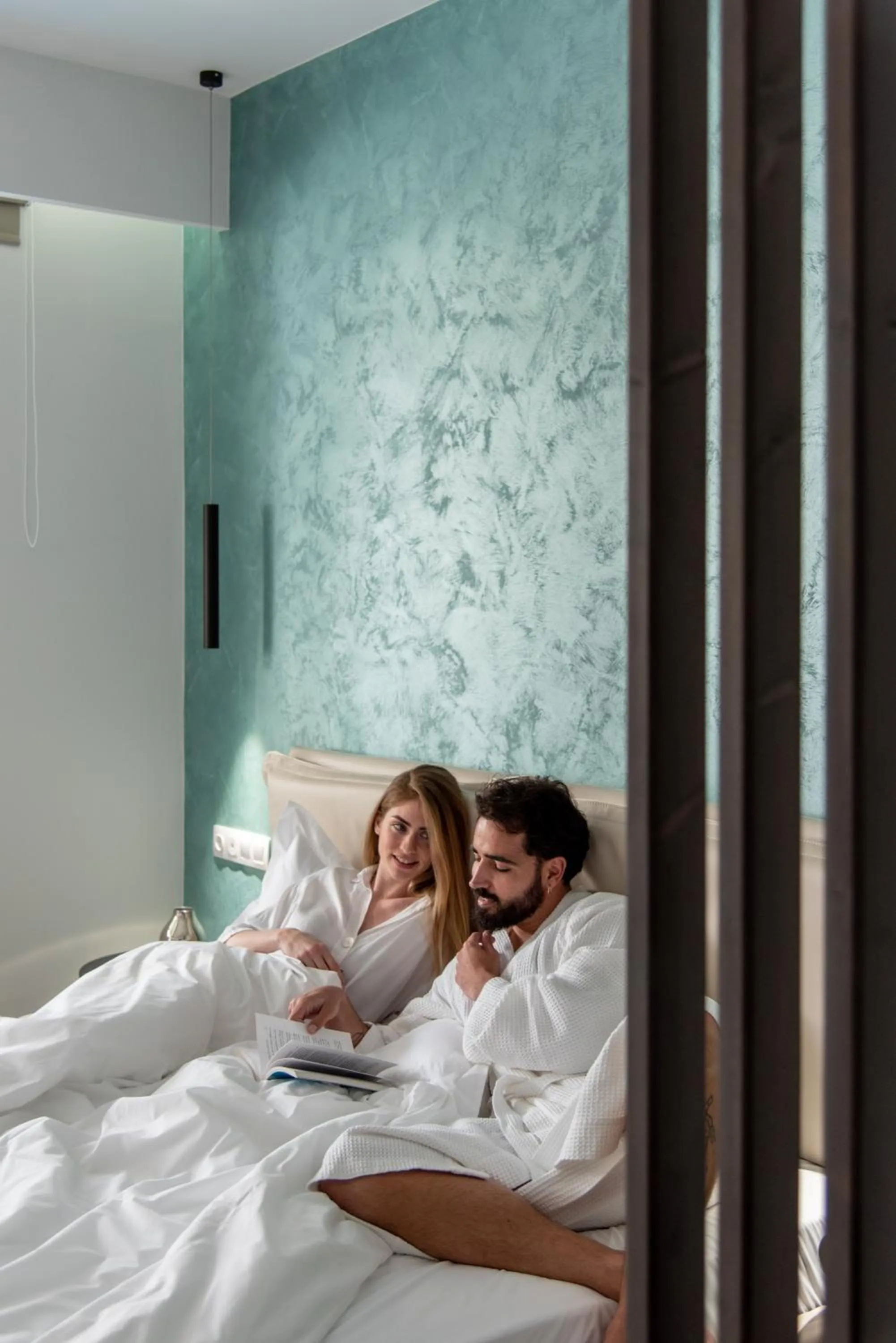 Bed in xSuites Hotel