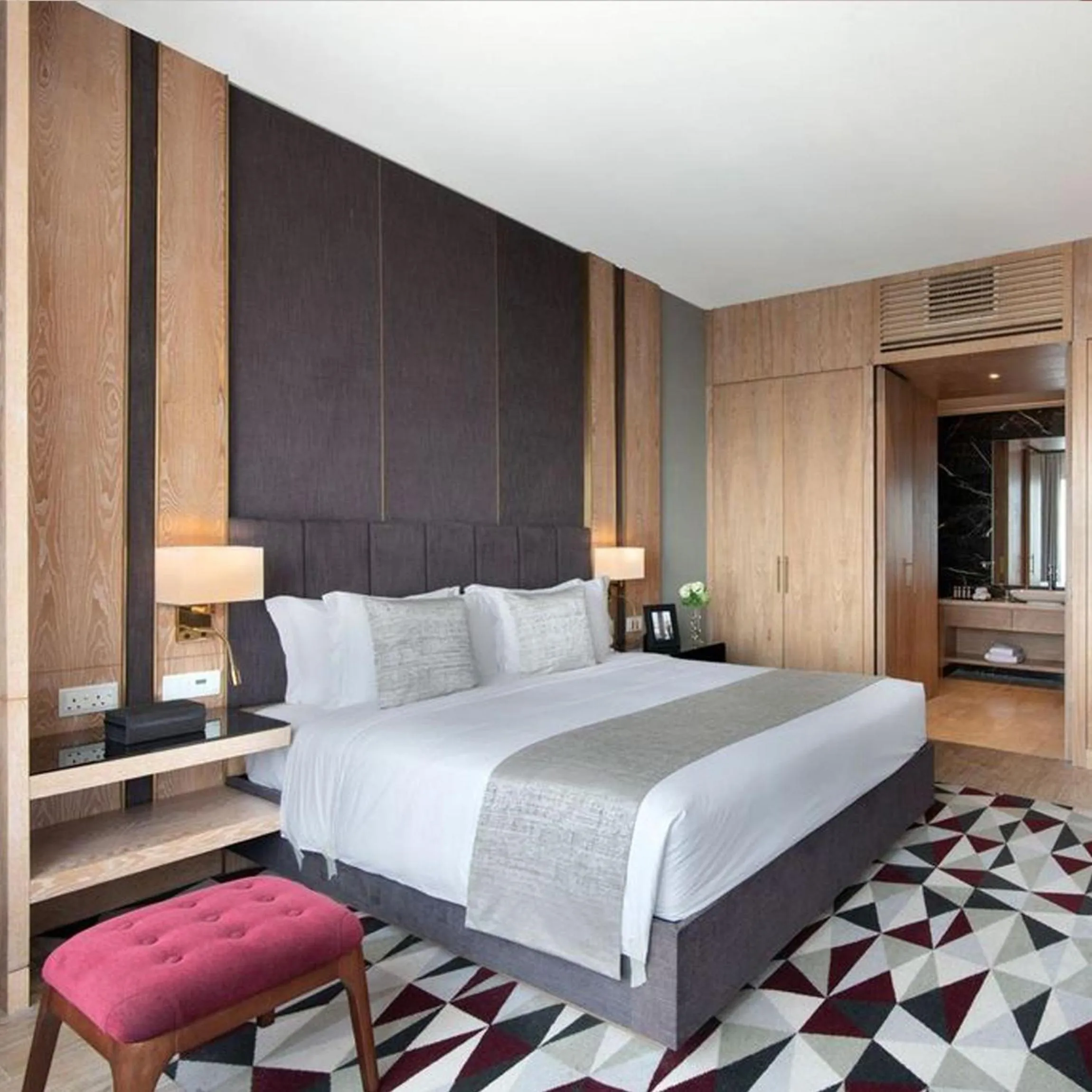 Bed in The Bentley Luxury Hotel & Suites