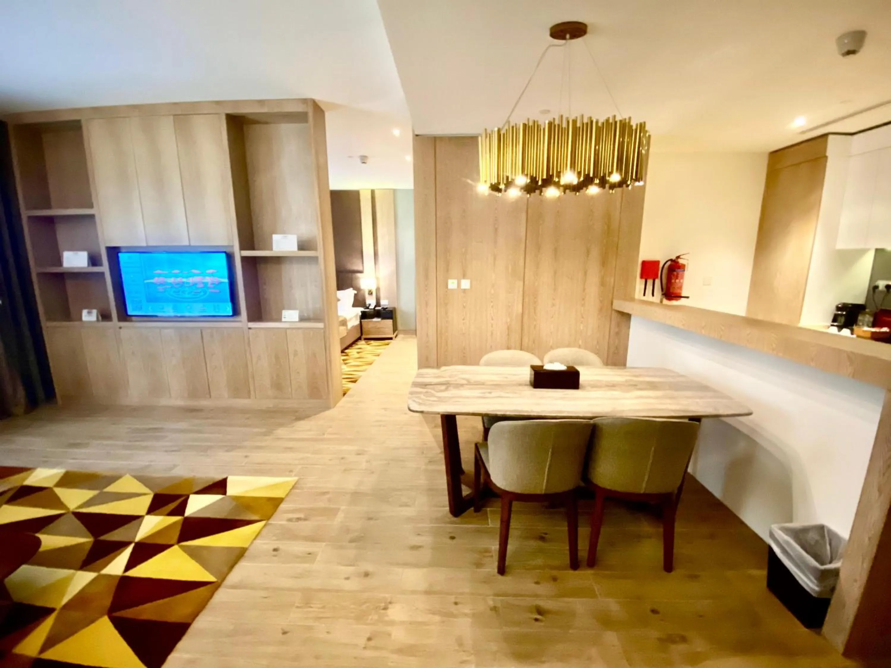 Dining area, Bed in The Bentley Luxury Hotel & Suites