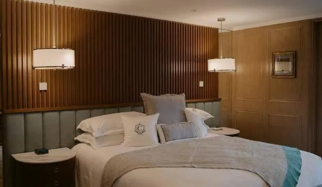 Bed in The Carlin Boutique Hotel