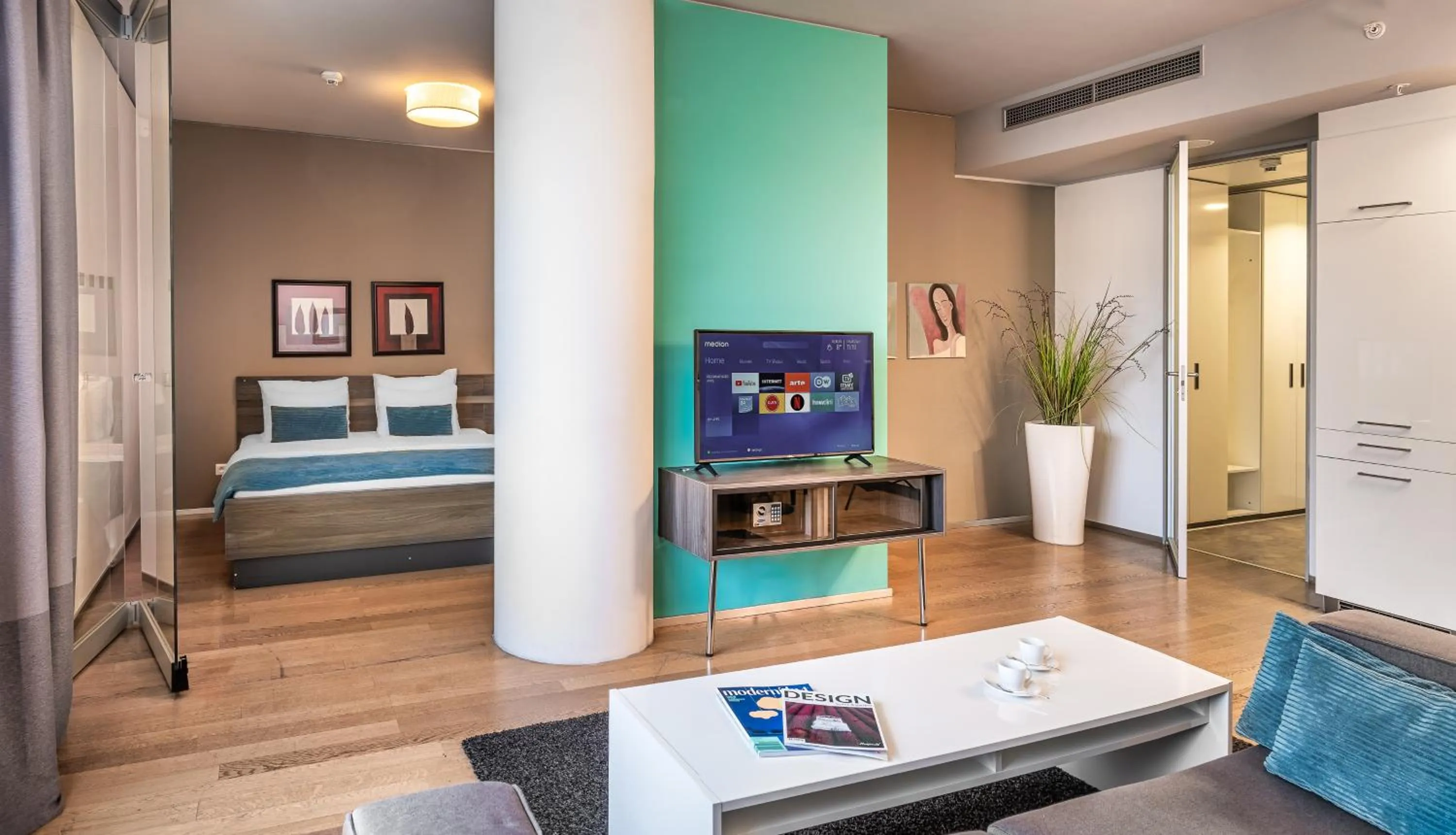 TV and multimedia, Bed in VN3 Terraces Suites by Adrez