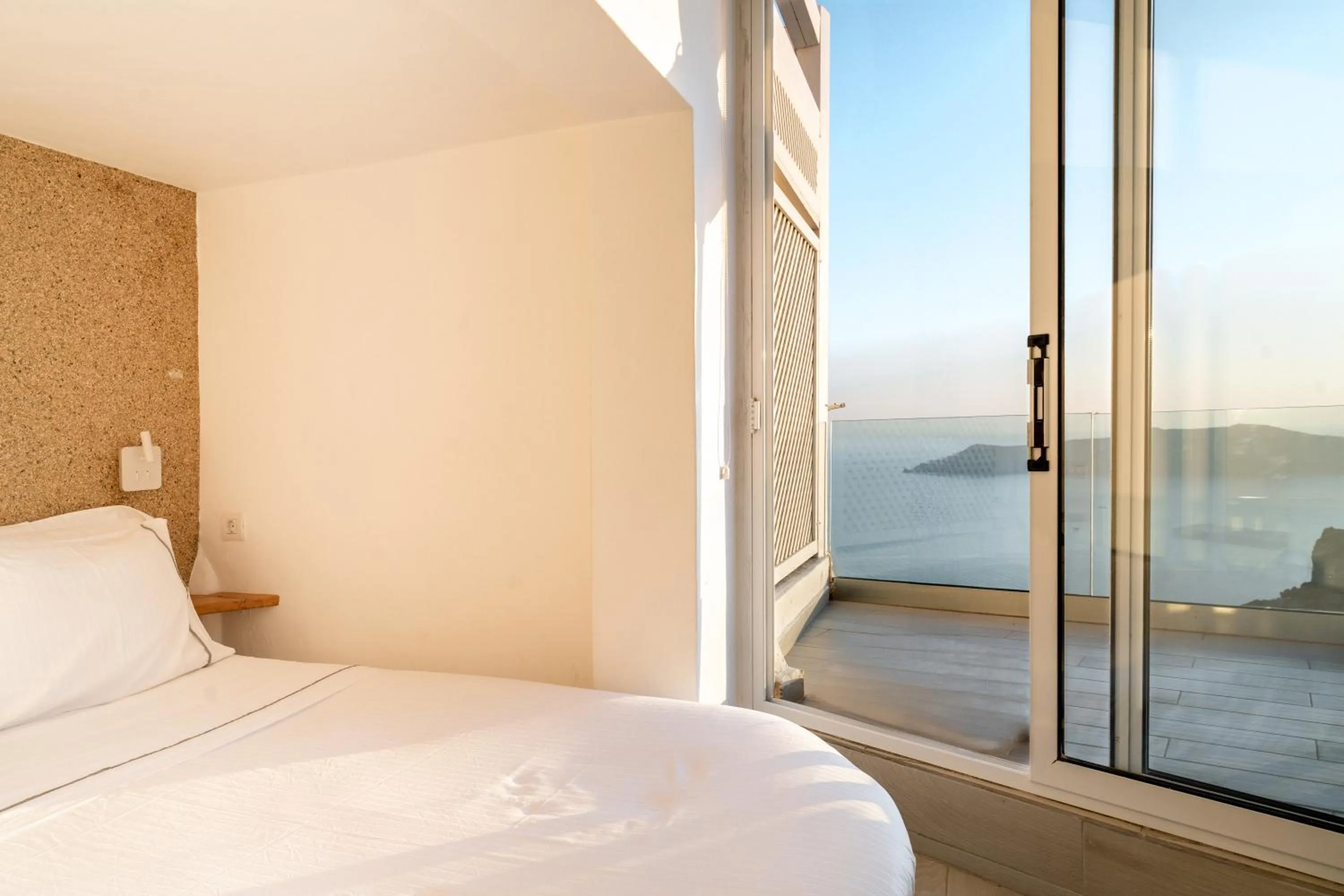 Bed in Anemos Cave Suites